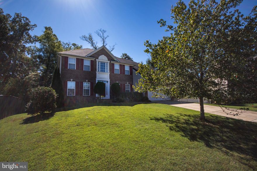 Welcome to this gorgeous 5 bedroom, 4 full bath, colonial home nestled in a quiet cul de sac in the well sought-after Simmons Acres in Accokeek. The piece de resistance… this home boosts the rare, hard to find bedroom on the main level and a full bathroom! The top level features 4 graciously sized bedrooms. The oversized owners suite features vaulted ceilings, large sitting area, walk-in closet, ensuite bathroom with double vanity, new tile floor with separate soaking tub and shower. The main level features formal dining room, and living room. The cozy family room with fireplace is just off the spacious eat in kitchen. This open area is perfect for entertaining as you cook and still interact with guests. Exit the double glass sliding doors from the kitchen to the screened in deck to relax and watch the sunset. From the 2 car garage enter the mud room and laundry room. The basement has a full bathroom with walkout to the backyard. Enjoy the community pool, tennis court, play area and walking trail with the family. This is home!