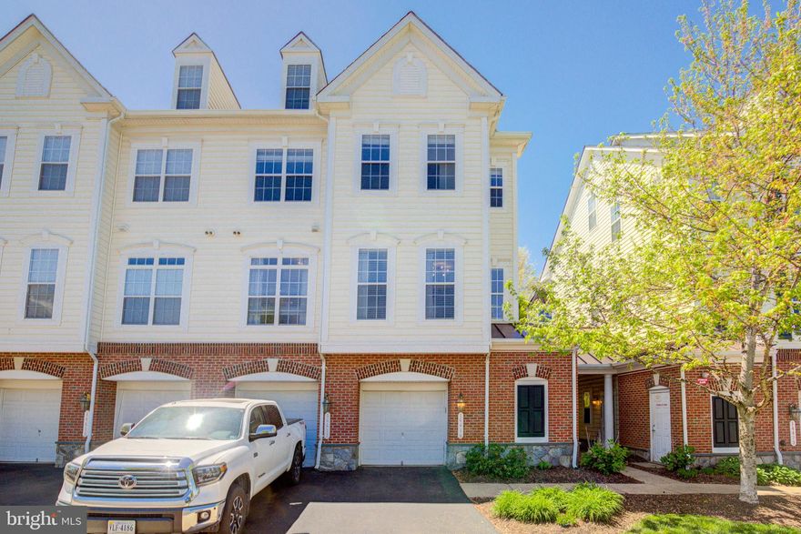 Gorgeous well kept end-unit condo townhome with a fantastic location. Tasteful landscaping is included in the Condo fee.  upgraded with granite counters, stainless steel appliances in the eat-in kitchen, recently painted and newly installed flooring on all levels. Nice open main living area, with gas fireplace and lots of natural light. The primary suite includes a large walk-in closet, dual sink vanity, large attached bath with soaking tub, upgraded ceramic tile, and a separate shower. The upper level includes two bedrooms with a full bath and an open area that could be used as an office, playroom, etc. This condo-townhome is very close to the Manassas Battlefield, Jiffy Lube Live Pavillion, Gateway shopping center, and easy access to the Haymarket and Gainesville Commuter Lots, 66 and 234. Close to restaurants and shopping. Monthly fees include water, trash, lawn mowing, and all community amenities.