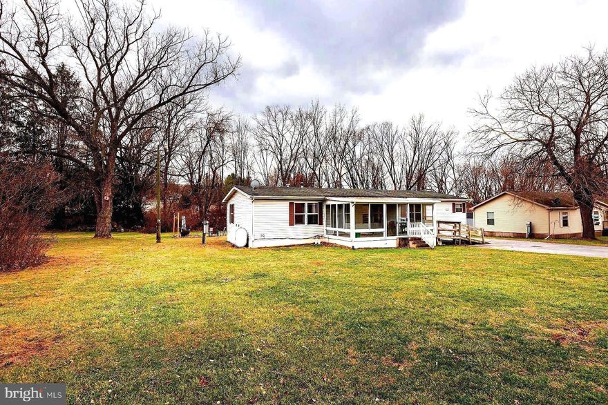 This charming ranch-style home, situated on a spacious 0.42-acre level lot in Salisbury Township, Lancaster County, offers the perfect blend of comfort and convenience. Surrounded by picturesque farmland, this one-story home features 3 bedrooms, 2 full baths, and a generously sized living room with a vaulted ceiling. The kitchen is well-equipped with ample cabinet and counter space, while the large dining area is ideal for hosting family and friends. A conveniently located laundry room sits just off the kitchen for added ease.

Enjoy breathtaking sunsets from the cozy front three-season room, which overlooks the scenic farmland. The tree-lined backyard provides a tranquil setting, perfect for daytime activities or relaxing by an evening fire. The detached two-car garage offers versatile storage options and the wrap-around driveway ensures plenty of parking space for your needs.