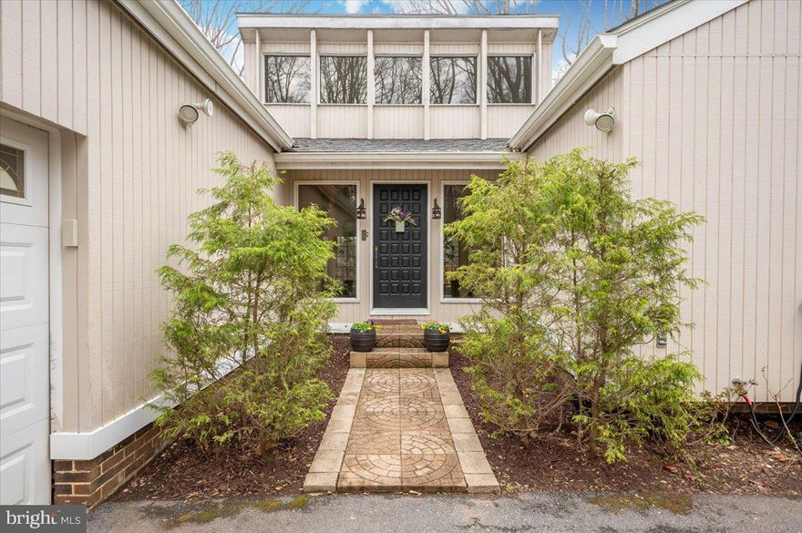 Welcome to 10101 Lloyd Road. Nestled on a private 1.32-acre wooded lot in one of the most desirable neighborhoods of Potomac, this beautiful mid-century residence offers the perfect blend of timeless design, modern comfort, and exceptional space.  This beautifully maintained home features 5 spacious bedrooms with 8-ft ceilings and 3 fully upgraded bathrooms, providing plenty of room for family living, guests, and work-from-home flexibility. At the heart of the home is a gourmet kitchen designed for both everyday living and entertaining, complete with generous prep space and seamless flow into the home’s inviting living and dining areas. A sliding glass door opens from the kitchen to a spacious outdoor deck, creating the perfect setting for morning coffee, grilling, and effortless indoor-outdoor dining. The living room offers another wonderful connection to nature, with direct access to a second expansive deck, ideal for relaxing, hosting gatherings, or enjoying peaceful views of the surrounding woods. Large windows throughout the home bring in abundant natural light and frame serene, wooded views, creating a tranquil retreat just minutes from everything. The fully finished lower level expands the living space even further, featuring sauna and versatile areas ideal for recreation, fitness, or entertainment. Outside, the 1.32-acre lot provides exceptional privacy with mature trees and natural landscaping—perfect for outdoor gatherings, quiet relaxation, or simply enjoying the beauty of the wooded setting from either of the home’s generous decks. Located in a highly sought-after community known for its top-rated schools, this rare Potomac mid-century gem combines space, privacy, and convenience just minutes from shopping, dining, and major commuter routes.  **A gas line is conveniently located along the right side of the property, offering an easy opportunity for future connection if a buyer wishes to convert the home’s heating or cooking to gas.**