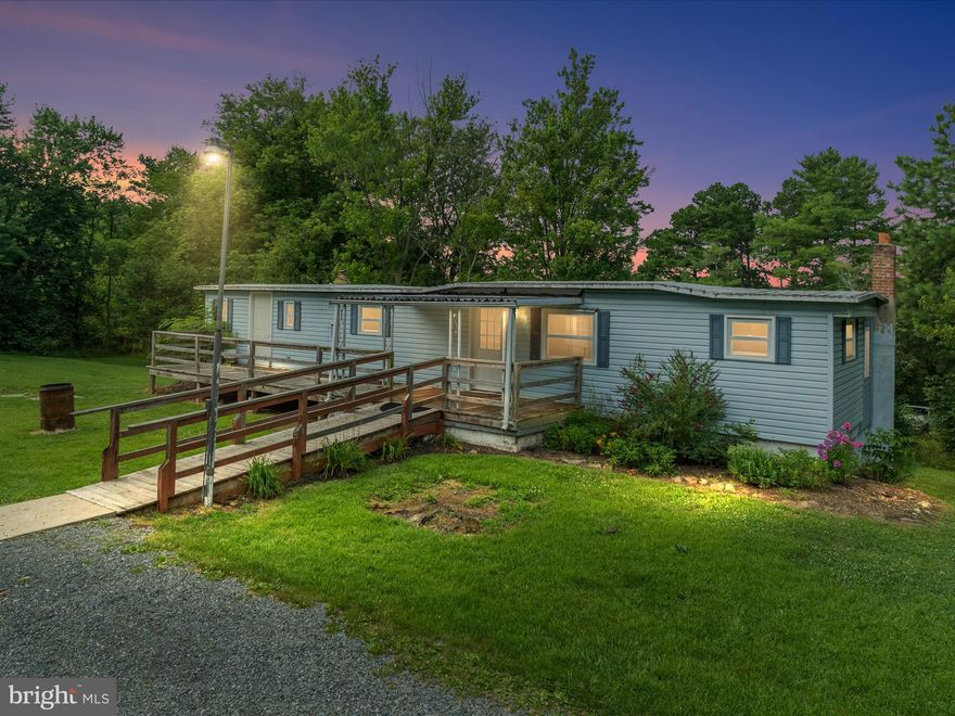 Come make an offer! Motivated seller! This property has more to offer than meets the eye: a great lot, full WALK-OUT basement. Easily renovate it or remove the double wide and add something new. All offers will be considered (currently listed below assessed value!!!). There is a fully functioning septic system and well with newer pressure tank and pump. The home includes three bedrooms, three bathrooms, multiple living areas, intact appliances, some updated windows, and a shed for storage. A strong opportunity for investors, rehabbers, builders, or DIY homeowners looking for a project with real potential—schedule your showing today!