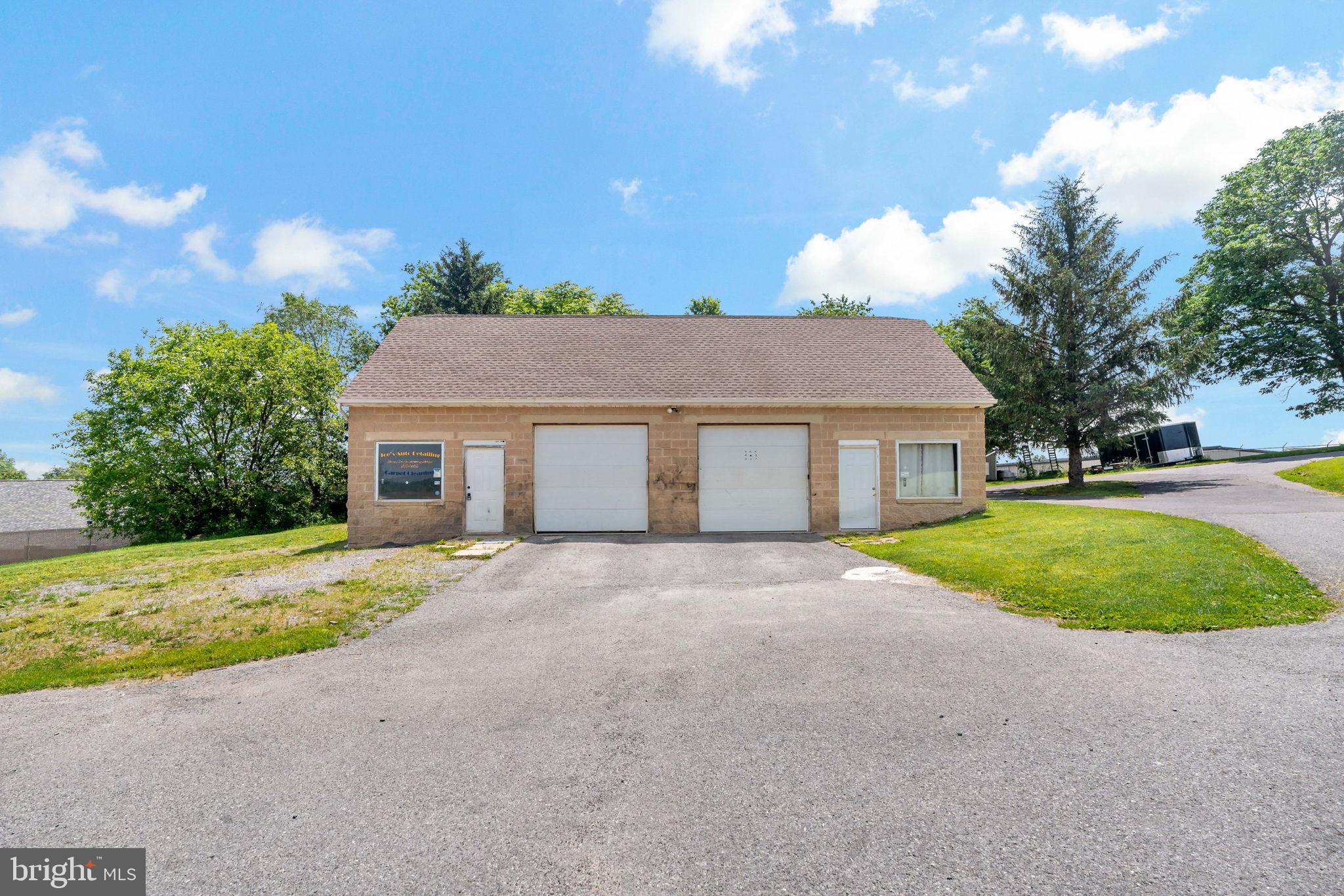 Multi use property, 2 bay garage with office and 1/2 bath with a 2 bedroom apartment upstair. Work, live lease multiple possibilities.