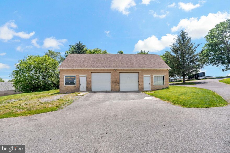 Multi use property, 2 bay garage with office and 1/2 bath with a 2 bedroom  apartment upstair. Work, live lease multiple possibilities.