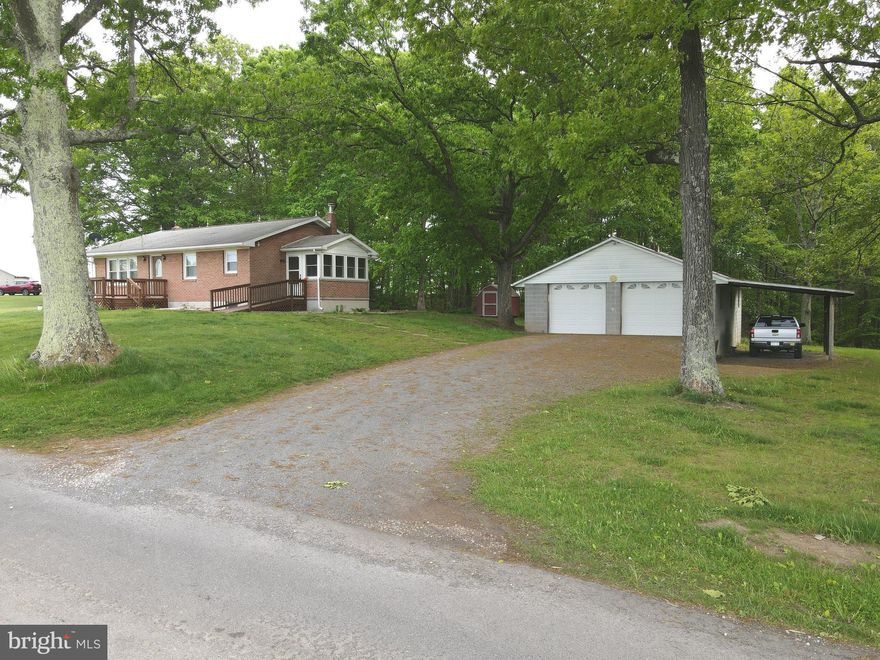 Call now to see this all brick ranch style home with partially finished basement on 5 unrestricted acres on  a hard cap road with access to all amenities nearby including banking. restaurants, schools and stores. This home is move in ready with hardwood floors, living room, eat in kitchen, 3 bedrooms , one bathroom and a  side porch and is handicap accessible. For easy clean up there is a central vacuum system. Also included are two outbuildings, detached three bay garage  with electricity and garage door openers.  A lean to is attached to the garage and all this is on the 5  rolling and wooded acreage with large hardwood trees and a pond. You can enjoy all the wildlife including deer, turkey , squirrels and other critters. Sit back on the porch and marvel at the panoramic scenic mountain views.