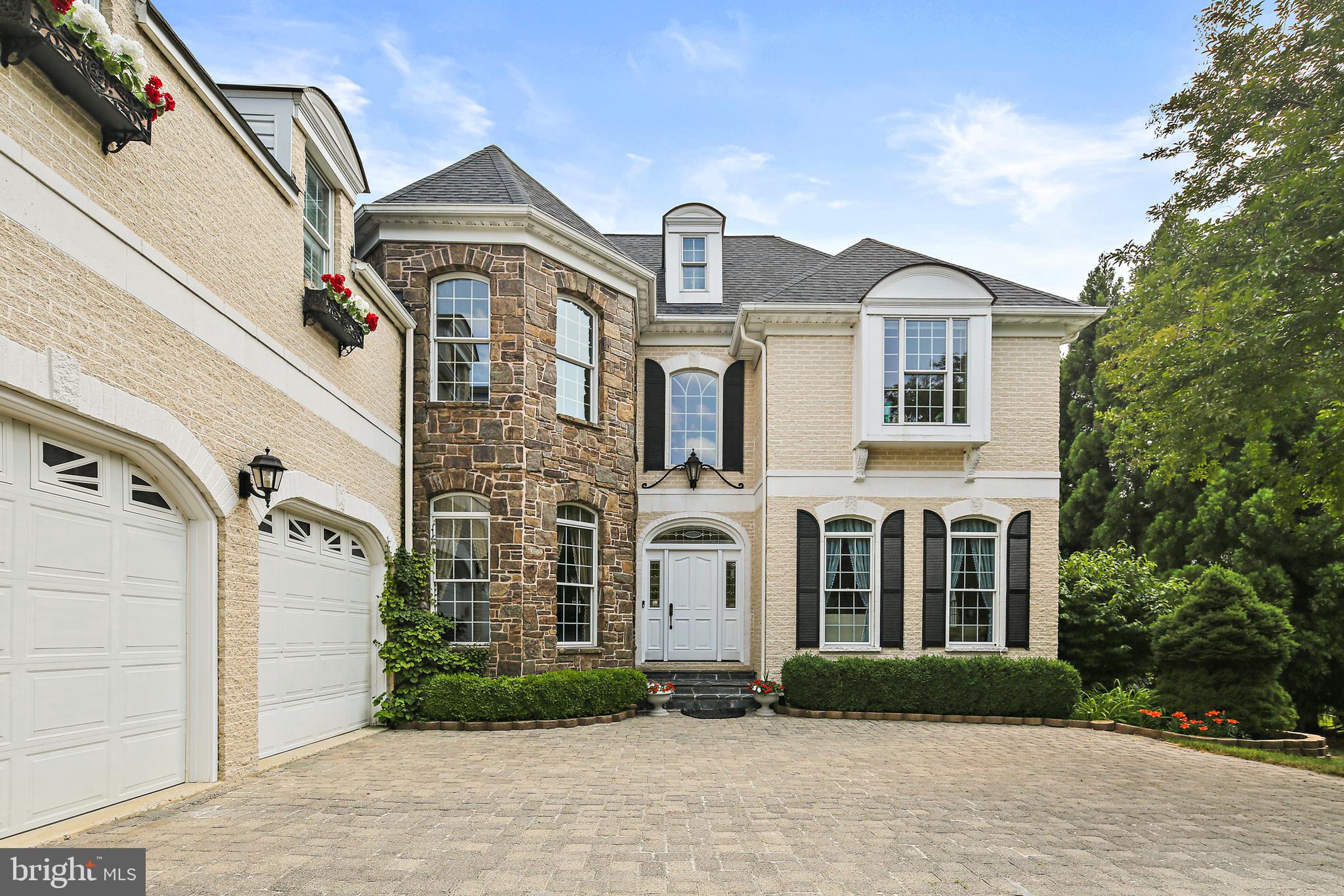 It's a once in a lifetime opportunity! This magnificent French Colonial, located in sought after Allnutt Farms, will WOW you from the moment you enter the driveway and stone paved courtyard. The attention to detail is second to none and immediately evident as soon as cross the threshold and enter the welcoming foyer. Soaring two-story ceilings abound, beautifully maintained hardwood flooring, a great room with gas fireplace and wall of french doors that lead to the raised patio which features paneramic views of the back yard and garden with waterfall, a private dining room with soaring windows, wall niche and intricate woodwork AND, the first floor bedroom with en suite bathroom is so convenient and perfect for your over night guests. These are just a few of the special features of this home! The gourmet kitchen - oh my! This gourmet eat-in kitchen's features are endless, showcasing travertine flooring, granite countertops, stainless steel appliances, and breakfast nook with built ins that features one of the two gas fireplaces. The upper level owner's suite is what dreams are made of! Private, spacious, and tranquil, with the most relaxing en suite bathroom with heated travertine flooring, tray ceiling with mood lighting, walk in closet, and private study. You will never want to leave this room! There are three additional spacious bedrooms on the upper level, one of which features a private bath, and the other two bedrooms share an adjoining bathroom. The lower level is the perfect place for entertaining. You will want to spend many hours in the spacious recreation room as well as watching your favorite sports and movies on the "big screen" in the theater room. All theater equiqment is included. Stay tuned, additional features to be added soon - like the brand new roof!