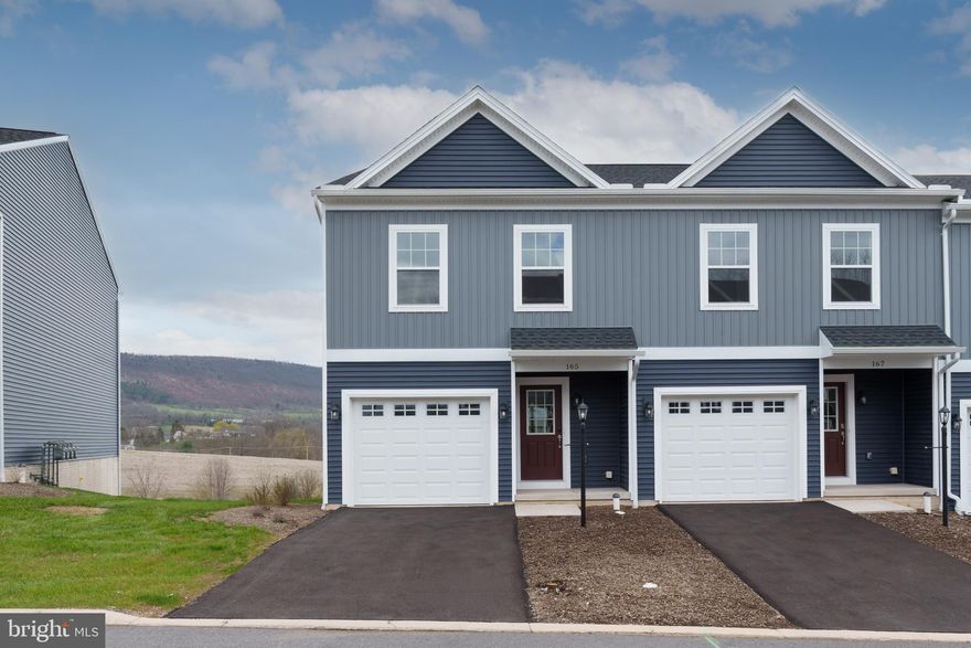 Steeplechase offers a suburban setting with walking paths and landscaped common areas, located 5 minutes from I-99, near Historic Bellefonte, and 10–15 minutes from Penn State University. 

The Steadfield end-unit plan features a kitchen with quartz countertops, gray cabinetry, a center island with overhang, and Whirlpool appliances, including a smooth top range, microwave, and dishwasher. Wafer LED lighting is included throughout. A 10' x 10' pressure-treated deck provides outdoor space. The owner’s suite includes a private bath, and second-floor laundry adds convenience. The home also includes an unfinished walk-out basement with a full window on the rear wall, a garage door opener, gas heat, and central air. 

Contact us for more details on this home.