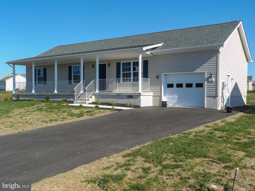 This ranch style house features 3 bedrooms and 2 baths with hardwood floors in living room, kitchen and dining room. Bedrooms have carpet. Hallways are wider and handicap accessible.