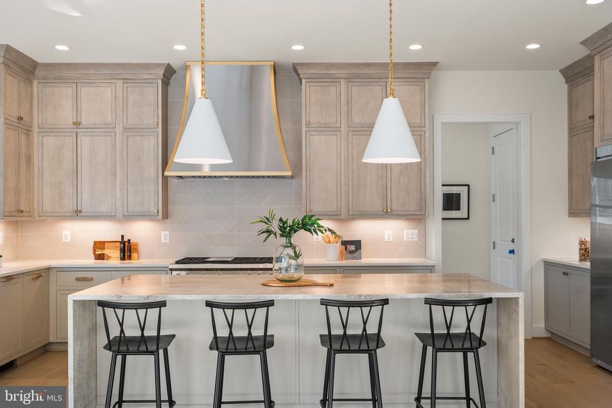 Just reduced to $2,789,000 for closing by December 31, 2025!

ELEVATOR READY! LUXURY FOR TODAY AND TOMORROW!

Experience luxury and elegance in this exceptional Gulick-built home, beautifully sited on a spacious 0.4-acre lot in one of Vienna’s most charming neighborhoods. Thoughtfully designed by the award-winning Sutton Yantis Associates, every detail of this residence blends timeless craftsmanship with modern sophistication.

Constructed with oversized brick on all four sides, the home makes a bold architectural statement while harmonizing seamlessly with its surroundings. A 3-car side-load garage preserves the home's stately curb appeal and provides generous space for parking and storage—without overtaking the front yard.

Spanning an impressive 7,470 square feet, the layout is open, airy, and sun-drenched thanks to expansive windows and soaring 10-foot ceilings on the Main Level. Whether hosting large gatherings or enjoying everyday moments, the flowing floorplan, Sunroom, and Conservatory create an inviting ambiance throughout.

At the heart of the home, the gourmet Kitchen is a chef’s dream—featuring inset cabinetry, a massive island, abundant storage, and a top-tier appliance suite including a 48” Wolf gas range and a combined 66” refrigerator/freezer. The oversized walk-in Pantry and Sunroom add both practicality and charm.

Indoor-outdoor living is effortless with wide sliding glass doors leading to a low-maintenance composite Deck framed by mature trees—ideal for relaxing or entertaining in privacy.

Stacked closets on all three levels offer the perfect opportunity for future elevator installation, making this home a smart choice for long-term living.

Upstairs, the Primary Suite is a private retreat, complete with a Sitting Room, two large walk-in closets, and a spa-inspired Bathroom with a freestanding tub, expansive shower with rain head, and elegant finishes. Three additional Bedrooms each feature ensuite Baths, and an upper-level Loft offers a flexible space for work or relaxation.

The fully finished Lower Level includes a Recreation Room, Wet Bar, Media Room, Hobby Room, Exercise Room, Guest Bedroom, and Full Bath—offering plenty of space for everyone.

Gulick Group Builders -  Award-Winning Design Meets Everyday Luxury