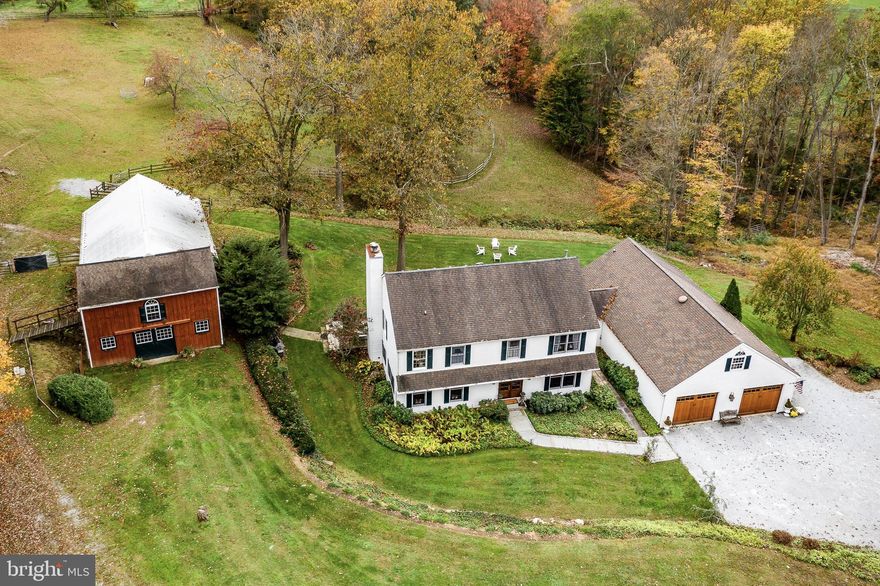 If seeking a private yet picturesque location is your top priority, then Harmony Hill Farm is perfect for you! You cannot see another home and the view is to die for!! The 4 BR, 3.1 BA home is nestled down a long lane on a lovely 14.4 acre parcel. The property has been well maintained with a newer Waterbury Designs crafted Kitchen, a high efficiency propane heater, new back porch, new floors, improved barn, whole house generator - the list is long! There is also a self contained office suite on the first floor that has its own private access that could also be used as a bedroom. There are seven garage spaces; two attached to the home and two separate detached garages, one with 2 bays and the other with 3 bays. Your horses will love the Barn with 4 big stalls, a wash stall, huge loft, and lots of main level storage space. There are two large pastures and the trail riding is boundless as you are across the street from the 1200+ acre ChesLen Preserve and lots of other open space. Radnor Hunt and Cheshire Hunt both have meets within easy hacking distance. Although privately located, you are 2 minutes from Northbrook, 5 minutes from Unionville, 15 minutes from West Chester, 30 minutes from Wilmington, and 40 minutes from the Airport. All this and in the highly sought-after Unionville-Chadds Ford School District.