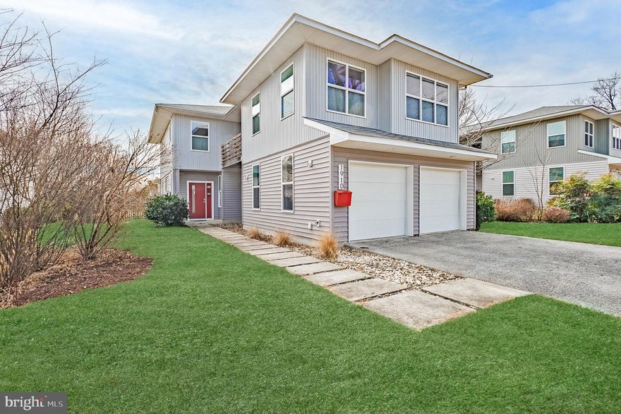 Modern. Effortless. Exceptionally Located.

Welcome to 1910 Plyers Mill Rd—a striking modern residence built in 2017, set on a standout, flat, oversized lot in the heart of Silver Spring, just 0.7 miles to the Metro. Thoughtfully designed where contemporary architecture meets everyday livability, this home offers comfort, efficiency, and flexibility in one of Montgomery County’s most connected locations.

From the moment you enter, soaring ceilings, an open and adaptable floor plan, and walls of natural light create a bright, airy atmosphere throughout. Built with a super-efficient insulation package, the home delivers exceptional energy efficiency, quiet interiors, and year-round comfort.

The heart of the home is the chef’s kitchen—featuring quartz countertops, stainless steel appliances, and a dramatic waterfall-edge island—perfect for entertaining, gathering, or casual everyday meals. The kitchen flows seamlessly into the living and dining areas, making the layout ideal for both hosting and daily living.

Upstairs, a spacious open sitting area provides a versatile second living space—perfect for a home office, lounge, or media area. Just beyond, a private balcony offers a peaceful indoor-outdoor retreat for morning coffee or evening relaxation. The Euro-style primary suite delivers a sleek, spa-inspired escape, while four generously sized bedrooms and 3.5 beautifully designed bathrooms offer space and flexibility for today’s lifestyles.

Additional highlights include tall ceilings throughout, a two-car garage, and thoughtful modern finishes. Outside, the expansive, flat lot is a rare find—ideal for outdoor entertaining, play space, gardening, or future customization.

The location is truly exceptional—minutes to Metro, restaurants, shopping, parks, and daily conveniences, with easy access to downtown Silver Spring, Washington, D.C., and major commuter routes. Urban energy meets neighborhood charm in this standout Montgomery County offering.

A unique offering to own a modern home on an oversized lot in one of Silver Spring’s most desirable and connected locations.