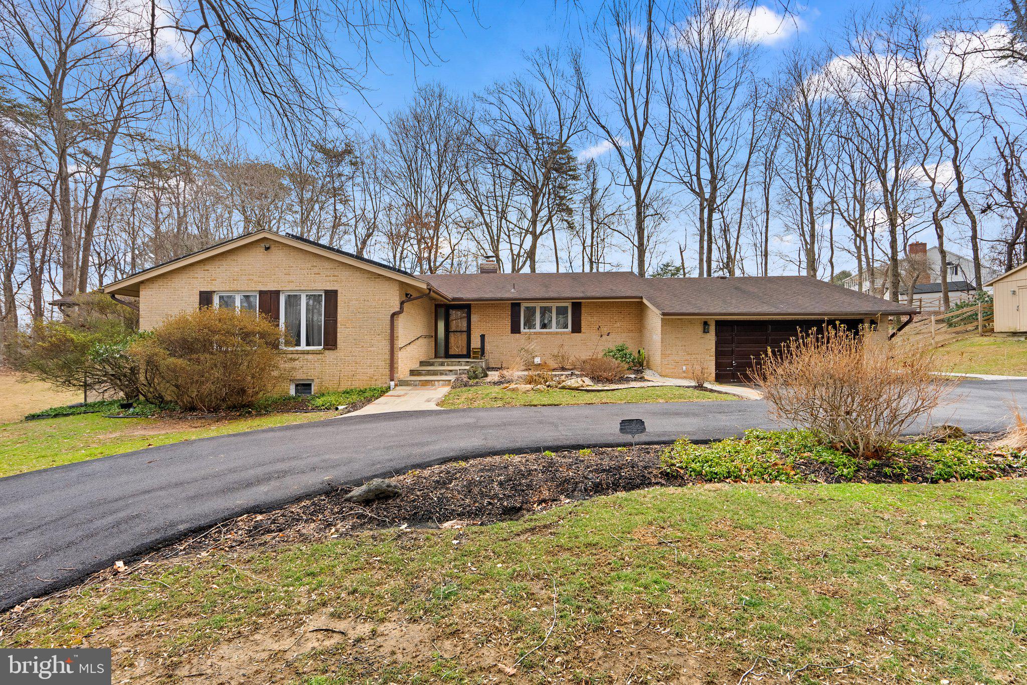 Spectacular doesn't begin to describe this one-of-a-kind home on two gorgeous acres. You will notice the mid-century modern, 70's inspired touches as soon as you walk up to the solid wood front door and into the foyer. The fully brick wood-burning fireplace is the centerpiece of the living room. You won't be able to miss the views of the large backyard, there are windows and sliding glass doors everywhere to showcase the private tree-lined lot! The fenced portion encloses about half an acre, but the lot extends all the way to the edge of the trees in all directions! On this main level you will find 3 spacious bedrooms, 3 full bathrooms, a gorgeous dining room, and large kitchen! Don't forget to check out the garage just off the kitchen! Downstairs there is spread out space to spare! Another large living room with access to the back patio, bar area, and several bonus rooms that could be converted to bedrooms if you need, a home office, a gym, the options are endless! Just through the laundry area are TWO MORE bonus rooms, so don't forget to look there! The first was used as a craft room, and the back room was a home workshop! Another bedroom and fourth full bath round out this incredible home! BONUS FEATURES: Solar panels that will be owned outright at closing! That means you get to reap the benefits of solar savings without any of the additional costs! This system was installed in 2024, so it's state of the art. A power bank is an option as an add-on for this system if the new buyer would like. Major systems have all been updated. This incredible home is ready for you to move right in and make it your own! You won't want to miss it, so call for your private showing today!