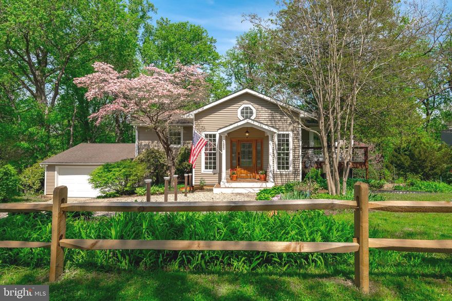 Interior Photos Coming! Nestled on one acre of land in Arnold's Ashcroft neighborhood, this delightful home is situated among flowers and mature trees. The Ashcroft Community pool is steps away. This home's creative floor plan gives buyers versatility with a main level primary bedroom and four bedrooms, two full Jack-n-Jill baths, and a second family room on the upper level. The primary bedroom has its own balcony to enjoy nature. The primary bath vanity was updated in 2025. Recently updated flooring and kitchen countertops in 2026. Fantastic entertainment opportunities in the generously sized great room that includes: family room with a wood burning fireplace, a vaulted ceiling over a flex space, dining table space, an island that can seat six, and a large kitchen and pantry. Laundry and mudroom are just off the two car garage. Stone patio with roof invites dining outside by the bubbling waterfall and pond. There's room for a grill and a fire pit. Unfinished storage room and bonus bump out space for a workshop in the garage. This charming  home is definitely worth a look!