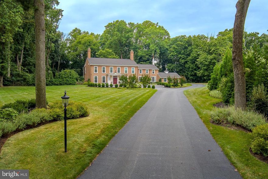 Sitting on a luscious level 1.9 acres, this elegant 4/5 bedroom, 5 full and 1 half bath Villanova home with a circular driveway offers a quiet retreat while being minutes from everything.  The grand marble foyer invites you into the fantastic, brick, 4304 sq ft home and sets the stage for this home’s fluidity and gorgeous views.  Off the center hall entryway are the sizeable formal living room with a gas, marble fireplace and the sunny formal dining room with large windows showcasing the beautiful views and creating the perfect space for hosting gatherings that are both large and small.  Convenient door to the covered back patio allows you to bring the party outside and enjoy dancing under the stars or taking a dip in the new heated in-ground pool and hot tub.  Just off the dining room is the spacious gourmet chef’s kitchen with high-end stainless steel appliances, granite countertops and breakfast area with sliders to the patio with outdoor kitchen, Barbeque and bar area.  Past the back stairs is a separate dining area that leads to the huge family room with vaulted ceilings and skylights. The Mudroom has a full bath, laundry room and access to both the 3-car garage and grounds.  Office/den with built-in cabinetry and bookcases and guest half bath complete this level.  Ascend the curved staircase to the primary bedroom suite overlooking the pool with 2 separate walk-in closets with built-ins (one which is a converted bedroom) and 2 full updated his/her primary baths.  Additionally, there are two spacious bedrooms with another updated full bath and large fourth bedroom and full hall bath with tub and 2nd laundry room.  End your tour with a stroll around the exquisite grounds and take in all this suburban oasis has to offer.  Located in the award-winning Lower Merion School District and easy commutes to King of Prussia, Conshohocken and Center City. Award-winning Lower Merion Schools.