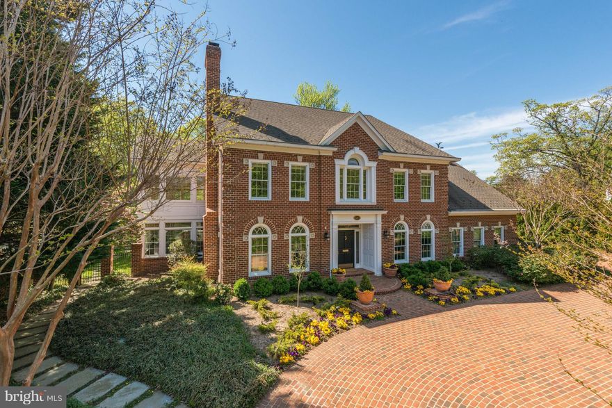 PRICE TO SELL!!  Looking for an offer! Stunning custom all brick colonial  highest quality throughout, 2 story foyer,elegant room sizes & special amenities including elevator, whole house generator, circular driveway & 4 car gar. Beautifully landscaped half acre lot with fenced back yard.Total of 4 bedrooms plus an au paire room and 4.5 baths and 4 fireplaces.Terrific location.