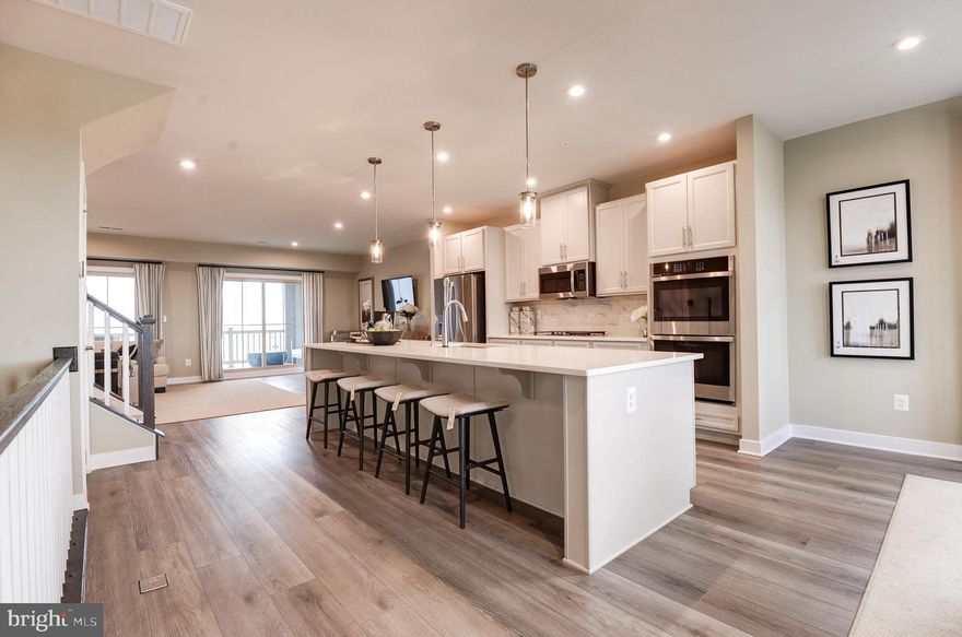 Previously, a BUILDER MODEL HOME at Arcola Town Center! Arcola Town Center is within a walking distance to Elaine E. Thompson Elementary School, Dulles Landing Town Center Shopping, & providing quick access to rte 50 & Loudoun County Parkway <br> <br> Condo is situated right across clubhouse & community swimming pool; just a block away to tot lot. Water, sewer, lawn mowing, & mulching is included <br> <br> Never lived in home! END CORNER, upper 2 levels (third & fourth), stacked, townhome style CONDO. Interior finished 2,484 sq ft equipped w/3 bedrms, 2 full baths, & 1 half bath; covered sky lanai & 1 rear car garage w/opener. Ample guest parking spaces available at the sub-division streets <br> <br> Ryan Homes built, Picasso floorplan, an open floorplan that allows light to flow through the entire area, an appealing modern design where comfort & convenience merge seamlessly; designed to be both practical & stylish. The first floor features chef's dream kitchen w/a huge work island & pantry, formal dining, & an amazing sky lanai off of the great room bringing the outdoors in. Upper bedrm level is a truly magnificent owner's suite featuring dual walk-in closets, sitting area, & a bath w/an oversized shower, dual vanities, & a water closet. Two generous secondary bedrms that share a hall bath w/dual bowl vanity, a linen closet, & a laundry complete the bedrm level <br> <br> Numerous options for groceries: Harris Teeter, Aldi, Walmart, Giant Foods, independent groceries, & more. Pharmacies: CVS & Walgreens. Easy access to shopping, transportation, recreation, & restaurants. Excellence in style, function & location