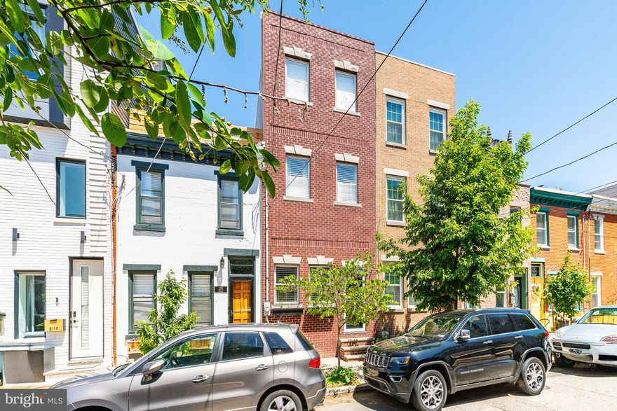 Welcome to this beautifully updated Graduate Hospital gem! Featuring a classic brick façade with vibrant window boxes, this 3-bedroom, 2.5-bath home offers an ideal blend of character and modern upgrades. The open-concept first floor boasts soaring ceilings, hardwood floors, recessed LED lighting, and a spacious eat-in kitchen with stainless steel appliances, granite countertops, newly installed honeycomb backsplash with gold accents, and upgraded hardware. A half bath and coat closet complete the main level.

Enjoy seamless indoor-outdoor living with a private rear patio - perfect for entertaining - offering space for a full patio set, dining table, and BBQ grill. Upstairs, find two generously sized bedrooms, a full bath, and a conveniently located washer/dryer. The third-floor primary suite includes a spacious bedroom, walk-in closet, ensuite bath with new double vanity, floor-to-ceiling subway tile, and a large picture window. Step out onto the private deck to enjoy unobstructed Center City views.

The finished basement provides additional living space, waterproof luxury vinyl plank flooring, and ample storage. Recent upgrades include a silver-coated, certified roof, refreshed brickwork, rear siding, and more. Prime location near Heirloom Market, Sprouts, Rittenhouse Square, UPenn, CHOP, local dining, parks, and public transit. Don’t miss this turnkey home - schedule your tour today!