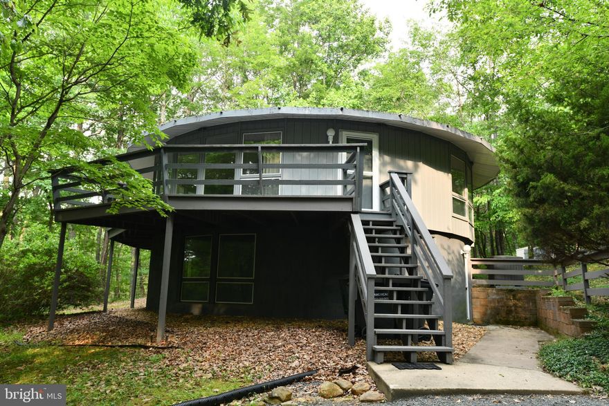 Sale includes adjoining lot (Tax ID 7100-51-2795) of additional 1.215 acres.  Unique dome house with lower level bedrooms - Both lower bathrooms updated with stylish tile & vanities - Spacious living room with standalone fireplace - Separate dining area - Eat-in kitchen w/ large pantry and built-in breakfast area - Generac generator conveys.