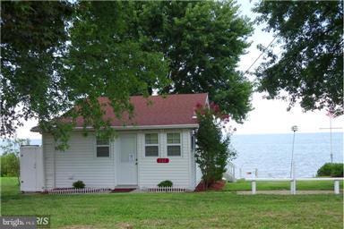 FANTASTIC BUY ON THE WATERFRONT!!! Beautiful HOME RIGHT ON THE CHESAPEAKE BAY. PRICE REDUCED!!!! BEAUTIFUL WATER VIEWS . This home has the possibilities to be enlarged. Second story possible. Pier permit Option, New roof, windows, bamboo floors, lighting, new appliances. Remodeled and in move in condition. Community Boat Ramp and neighborhood beach.