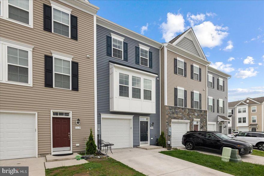 Over 2200 square feet of living space in this 3 finished level garage townhome.  High ceiling and oversized windows surround this contemporary living space with large island kitchen in the center of this home.  Perfect for entertaining or a quiet night at home.  The upper level has an enormous master bedroom with tray ceiling, full bath with double vanity and tile shower, finished with a walk in closet.  The secondary bedrooms are good sized with plenty of closet space.  The entry level offers another living area which can be used in multiple ways, an entertainment space, home office, workout room or guest space with separate bath.  The garage and driveway provide convenient parking, with additional guest parking just a few feet away.  This quiet community is nestled into a convenient location, close to commuter routes, shopping and historic downtown Winchester.  Enjoy this contemporary like new home while being in close proximity to parks, restaurants, and many historic and nature areas.