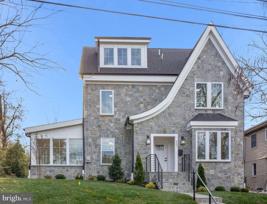 This spectacular home is basically a new build. Nestled in the heart of a very sought after Takoma Park neighborhood this is a must see! From the stone exterior to the details of the interior, this home is stunning.  The spacious front entrance is well lit and covered from the elements.  Upon entering this magnificant home, the foyer opens to a bright, open and inviting floor plan with 9ft+ ceilings, beautiful engineered hardwood floors, fresh neutral paint throughout, custom crown molding, modern lighting, premium stereo system wiring, and beautiful picture windows which let in lots of natural light.  A convenient office is just off the foyer.  Beyond the living and dining rooms is a wonderful and inviting sunroom. As you move to the rear of the home, you are greeted to a familyroom open to a gourmet eat-in kitchen with top-of-the-line Bosch appliances, custom cabinetry and a convenient breakfast bar. The kitchen has sweeping views of the private back yard and exits to an expansive private stone patio with a retaining wall making it a great place to relax or entertain.  The impressive kitchen features quartz countertops and backsplash, soft close cabinets and drawers, stainless steel appliances, canopy range hood, pantry, beautiful lighting.  The main level also features a convenient half bath.  On the first upper level, you will notice the additional recessed lighting and theater lights on the stairs which lead to 4 spacious bedrooms, all with their own, or a joining full bathroom.  The primary bedroom includes two closets, one a walk-in closet and all with custom built in shelves.  The primary bathroom (one of two) features double bowl sinks and an expansive walk-in shower with a free-standing luxurious soaking tub surrounded by beautiful custom tile and a large window.  A perfect sanctuary.   The first level also features a laundry room (one of two) with washer and dryer hook ups, a utility sink and convenient cabinet to hold all your laundry needs.  The second upper offers an amazing loft with a wet bar featuring  quartz counter tops, a deep sink and a built-in wine cooler.  The spectacular loft also features a 5th bedroom and a full bathroom.  The lower level of this amazing home features a recreation room, a 6th bedroom and full bathroom, another laundry room with storage, a utility room with storage and additional storage space under the stairs.  All of this can be yours and is conveniently near shops, restaurants, parks and minutes from Takoma Metro Station and Washington, DC. Enjoy close proximity to Starbucks, Spring Mill Bakery, TPSS Food Coop, Busboys & Poets and so much more. Welcome and enjoy!