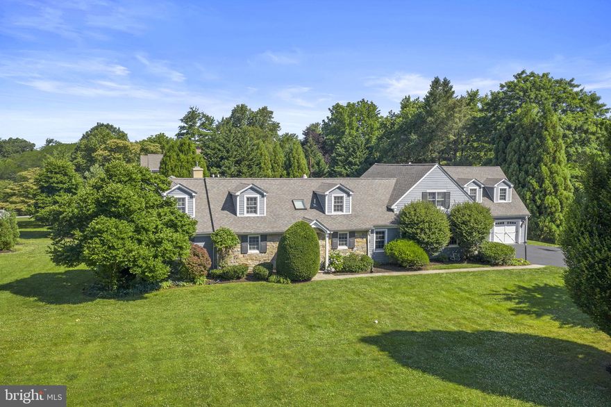 Refined interiors and park-like grounds create a luxurious and versatile 6 Bedroom 6.5 Bath home in Lower Merion Township.  Inside the 6,000 square-foot residence the vaulted entry way introduces the gracious and sophisticated living and entertaining spaces highlighting the extensive renovations and additions that include hardwood floors and millwork throughout with tremendous attention to detail. Upon entering the foyer, the large formal dining room has a painted accent wall with windows that showcase the 550-bottle temperature-controlled wine room.  The formal living room has a large bay window, gas fireplace with detailed woodwork and access to a private “hidden” office that has built-ins and beautiful windows.  The stunning kitchen is a gourmand’s delight with crafted cabinets including multiple china cabinets and built-in command center, granite topped buffet, breakfast bar that seats 4+, granite tops, center island with butler’s sink, and top of the line appliances including a six-burner GE Monogram range, double ovens and a vented range hood, Sub-Zero refrigerator, an LG dishwasher, two sinks, radiant heated floors, and a Kenmore Convection microwave. An adjacent sun-filled morning room welcomes casual dining. There is a separate butler’s pantry that is equipped with a KitchenAid ice maker, second LG refrigerator, KitchenAid oven, and Bosch dishwasher and provides access to the wine room. The two-story family room houses a wall of windows that overlook the beautiful, private back yard. French doors lead to large slate patio, with retractable awning, that extends to an outdoor fireplace and wood burning pizza oven housed under a wisteria-covered pergola. The back of the home meets the needs of everyday living and is a true haven for entertaining! Adjacent to the breakfast area is a second office/den, mudroom, half bath, back stairs and access to the two-car heated garage that has been expanded to include additional storage with separate access doors to the back yard. The private first-floor bedroom suite is wheelchair accessible and includes a custom bathroom and closets allowing for a variety of uses.   
The second floor includes 5 additional bedrooms and 4 full baths.  The primary bedroom features separate closets, large bath with jacuzzi tub, radiant heated floors, large shower with seamless glass door and double vanities. In addition to this bedroom there is a guest suite with private bath, two bedrooms adjoined by a jack-and-jill bath, and another bedroom suite with private bath and generous closets that is accessed from the back stairs.  There is a large laundry room with shelving and storage and generous linen closets throughout.  The finished Lower level is ideal for many uses with rec room, separate offices, and full bath. There is also unfinished storage space and the mechanicals.  
The attention to detail and care is evident throughout the home creating unique settings for entertaining as well as the living spaces any family desires. With Two separate Offices the ability to work from home could not be more convenient & allows for the flexibility needed in the current work/professional environment. The location is close to shopping, the airport, regional rail and schools. Numerous parks are close by - Ashbridge Park that has over 28 acres dedicated to playgrounds, running trails as well as tennis and sledding. Stoneleigh is up the street and features 42 acres available for exercise, picnics, and horticulture. The combination of the private setting of the home with the accessibility of these amenities creates a perfect balance for today's family.