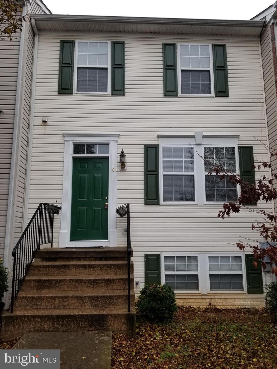 Freshly painted, new carpet. Rear Deck with steps into fenced yard. Three bedrooms, 3 1/2 Baths, finished family room in basement with gas fireplace.
