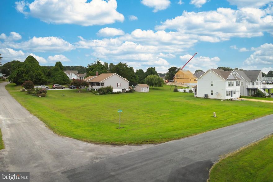 3/1621 Cleared, corner level lot that offers views of the Chincoteague Bay and the canals that wind throughout Captains Cove and Chincoteague Island. Lot has water and sewer availability. Corner lot offers placement options. Come and enjoy all the amenities and the lifestyle of the Eastern Shore of VA, close to Chincoteague Island, Wallops Island and Ocean City MD. Captains Cove is the fastest growing Golf & Waterfront community on the Eastern Shore of VA. HOA amenities: Prestine 9 Hole Golf Course, indoor/outdoor pools (2), fitness center, tennis, pickle -ball & basketball courts, playground, boat ramp, dog park, biking & walking trails security and so much more.