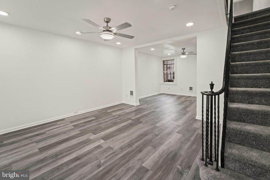 Fully Renovated 4-Bedroom Rowhome in Southwest Philadelphia! Welcome to your beautifully renovated urban oasis in the heart of Southwest Philadelphia! This stunning 4-bedroom, 2-full bathroom rowhome seamlessly blends modern comfort with historic charm. From top to bottom, no detail has been overlooked in this thoughtfully updated residence.  Step into a bright and airy living space adorned with modern finishes, remote-controlled modern ceiling fans, recessed lighting (with 2 colors!), new LVP throughout, newly carpeted stairs, freshly painted walls, and new windows and doors, creating a welcoming atmosphere throughout. The heart of the home is the brand-new kitchen featuring stainless steel appliances and stylish cabinetry. Whether you're a culinary enthusiast or enjoy casual family meals, this kitchen is sure to impress.   Four generously sized bedrooms provide ample space for a growing family or the perfect opportunity for a home office or guest room. Each room boasts plenty of natural light, closet space, and newly installed flooring.  Indulge in the comfort of two fully renovated bathrooms featuring modern fixtures, sleek tile work, and spa-like finishes. The perfect retreat after a long day.  The thoughtfully designed floor plan maximizes space and functionality, offering a seamless flow between the living, dining, and kitchen areas.   The basement is built out that you could convert to a 1 bedroom apartment if you choose.  Benefit from peace of mind with updated electrical, plumbing, and heating systems. A very unique feature is that each room has individual wall heaters with their own thermostat.  No more complaints that it is too hot or too cold for anyone.  This home is move-in ready with all the modern conveniences.  Situated in a vibrant neighborhood, this rowhome is just moments away from local shops, restaurants, public transportation, and parks. Experience the best of city living with all the amenities at your doorstep.  This fully renovated rowhome presents a rare opportunity to own a piece of Southwest Philadelphia's history with all the modern luxuries. Schedule a showing today and envision the lifestyle that awaits you in this stylish and turnkey residence!