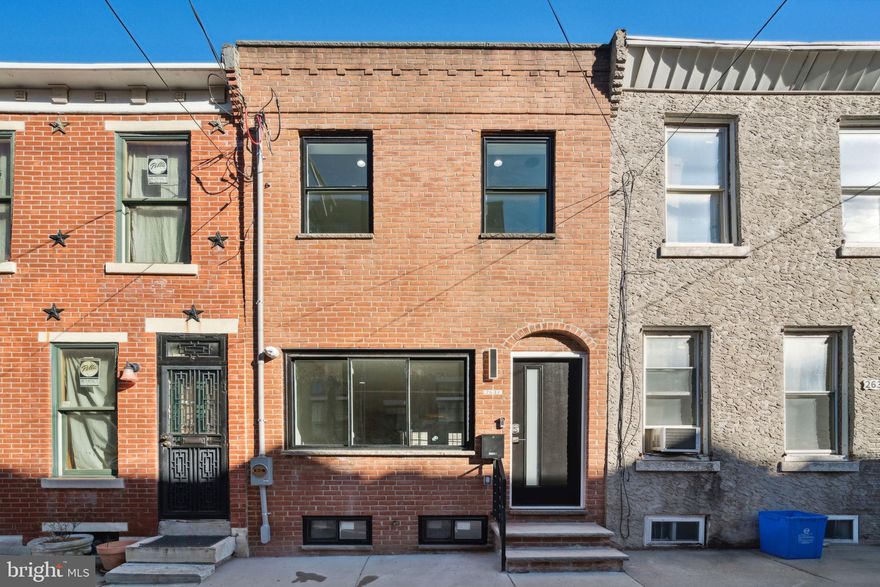 Welcome to 2637 Webster Street, a meticulously renovated home in the heart of Graduate Hospital. This residence boasts a charming brick facade, contemporary finishes, 2 bedrooms, 2 bathrooms, and 950 square feet. As you enter inside this completely rehabbed home, you’ll be greeted by wide plank flooring, and large windows allowing tons of natural light. The living area boasts an electric fireplace and floating staircase with 4-inch steps, providing a modern focal point. The open-concept layout allows for a seamless flow between the living, dining, and kitchen area. The kitchen features stainless steel appliances, a large island perfect for barstool seating, and tons of cabinetry for storage. Upstairs, you'll find 2 spacious bedrooms offering ample closet space and en-suite bathroom with double vanity, and a sliding glass door shower. A finished basement provides additional space for recreation or a home office. Just steps away from University City and in close proximity to all of the restaurants, bars, grocery stores, parks, and coffee shops that Graduate Hospital has to offer, this home is in a perfect location. Schedule your showing today!