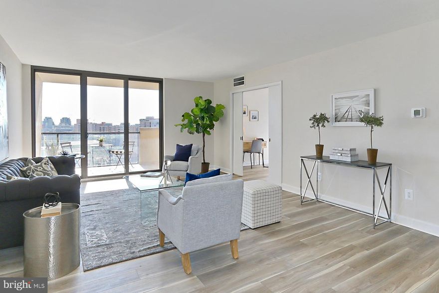 $10,000 credit towards buying down buyer's interest rate.
DO-NOT-MISS this beautifully and tastefully renovated two bedroom unit in The Representative condo building - comprising almost 1600 square feet of well-laid-out space accentuating an inviting kitchen/dining area flowing into the massive living room.  Want even more living room space?  Then pull open the pocket door of the second bedroom, and voila, your wish has been granted!  For closet space, you have four walk-in closets - three in the main suite and the fourth in the 2nd bedroom.  Also, outside the unit, bearing left and down the hall is a large storage room numbered 709 in the corner. It is yours, as well as a storage cage on the P-1 parking level,  also numbered 709.  Relax on the very large balcony and take in your surroundings, including a clear view of the city all the way into DC; and right in front is Pentagon Row where you can grocery shop and patronize the many restaurants and other small businesses catering to your everyday needs.  And just across from Pentagon Row you'll find Pentagon City Metro and the flagship Pentagon City Mall!  How convenient is that?  Everything is walkable! So many reasons to ditch that car!  Parking space 238 on the P-2 garage level conveys.  There's an exercise room, sauna, meeting room, business center and outdoor pool for your use. NB: If your all-in-one washer/dryer is not installed by closing, you will be given a check for $2000 in lieu.  Plus, right across from your unit is a laundry room with a commercial size washer and dryer for your use, free of charge!   Come check it out today!