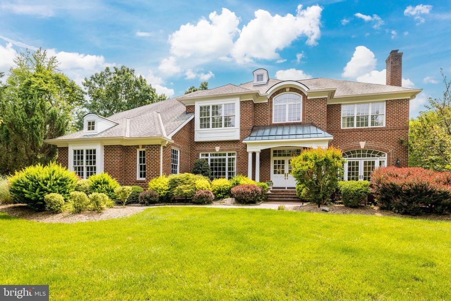 Nestled in the highly coveted neighborhood of Deep Glen Estates in Great Falls, Virginia, this stunning six bedroom, five full bathrooms and two half bathrooms property on 1.36 acres,  boasts flexible spaces for formal and casual gatherings.  The beveled glass double front doors welcome you into this custom colonial.  The entrance hall is highlighted by a magnificent staircase that ascends gracefully through soaring ceilings, while the gleaming marble floors exude a sense of spaciousness.  The main level features a living room, with French doors leading to a brick courtyard, dining room, private office and a stunning family room with walls of windows within a twenty foot coffered ceiling. The kitchen greets discerning chefs with its premium appliances and handsome cabinetry, complemented by exquisite granite countertops. Adjacent to the three-car garage, the laundry room/mud room is thoughtfully positioned for effortless accessibility to the kitchen and deck. The veranda with Azek decking  off the main level, is the perfect year-round entertaining area. The welcoming space offers outdoor heaters, ceiling fans, grill station, granite prep area and with stunning views of the private backyard.  Upstairs, from either the front or back staircase, you’ll find the primary suite with coffered ceilings, built-in custom bookcases and windows overlooking mature trees.  Providing the perfect oasis for relaxation after a long day, the spa bathroom features a soaking tub, walk-in shower and heated floors. Three additional bedrooms and two full bathrooms offer plenty of space, natural light and ample closets. The lower level provides an ideal setting for entertainment and boasts a generously sized recreation room with a beautiful custom cherry bar and an inviting wine/tasting room.  Additionally, there are two extra bedrooms, two full bathrooms, and a bonus/flex room that complete the expansive lower level. Through the double French doors, you can access a large covered flagstone patio that provides breathtaking views of the flat, tree-lined private backyard. This stunning home combines luxurious finishes, spacious living areas, and a prime location. It is conveniently situated just minutes away from Tysons Corner, Great Falls Village Center, the Dulles corridor, and major roadways. Prepare to feel right at home in this exceptional gem of a property.