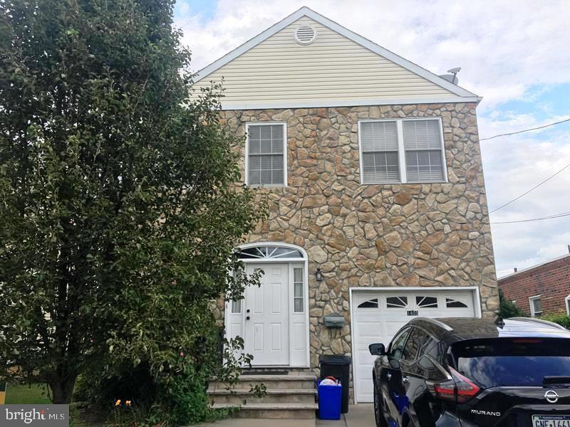 Welcome to this spacious townhome located in desirable Rhawnhurst section of the city . Property features large living room room /dining room open floor plan, 1st floor powder room, ultra modern kitchen with center island breakfast bar, and additional separate area that can be used as separate eating area or family room  with walk out access to oversized rear yard great for entertaining. Second floor boasts man bedroom suite with custom closets and 3pc. ceramic tiled bathroom, 3 additional bedrooms with ample closet and 3pc. ceramic tiled hall bath, linen closet and laundry room. Fully finished basement with walkout entrance to rear thru bilco doors. Driveway parking 1 car garage, conveniently close to shopping, schools and public transit.