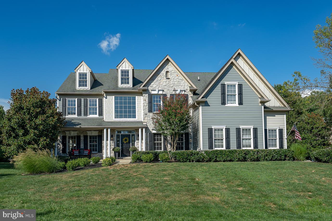 Welcome to 4 Dever Drive, a spacious 5 Bedroom, 4 1/2 Bath Colonial, in the highly sought-after community of The Estates at Mill Creek. Enjoy all the features you would expect to see in this beautiful home including, a brand new exterior with Hardi Plank Siding, gorgeous hardwood floors throughout the 1st floor, extensive millwork, open floor plan, freshly painted and new carpet upstairs. Enter the 2-story foyer with a turned staircase, to the right is an office with built-ins, perfect for working from home in today's environment. To the left is the living room and formal dining room - ideal for hosting and entertaining. This leads to the 2-story family room, kitchen and breakfast room - this gorgeous family room will take your breath away. The gourmet kitchen has a center island with granite countertop, stainless steel appliances, gas cooktop and a pass through to a large breakfast room with a vaulted ceiling. The 2-story family room has a wall of windows with shutters, gas fireplace with extensive millwork and back stairs leading to the 2nd level. The 1st floor also features a powder room and a laundry room which leads to the 3-car garage with built-ins and a workbench. Head up the stairs to the Primary Suite with a tray ceiling, cozy sitting area and a large walk-in closet. The Primary bath has an oversized tub, stall shower, double sinks and a private water closet. There are 3 additional bedrooms, one that has an ensuite bath and 2 that share a hall bath. Don't miss the amazing basement with the 5th bedroom and full bath, kitchen area with a wine frig, sink and dishwasher, theatre area, plenty of storage and bilco door. Head outside and you'll find a fabulous, private patio with a built-in grill, sink, refrigerator and a granite countertop. There is even a built-in fire pit for those chilly evenings. This home is located in the award winning West Chester School District and is conveniently located to shopping and restaurants. A perfect home with all of the amenities for today's lifestyle.