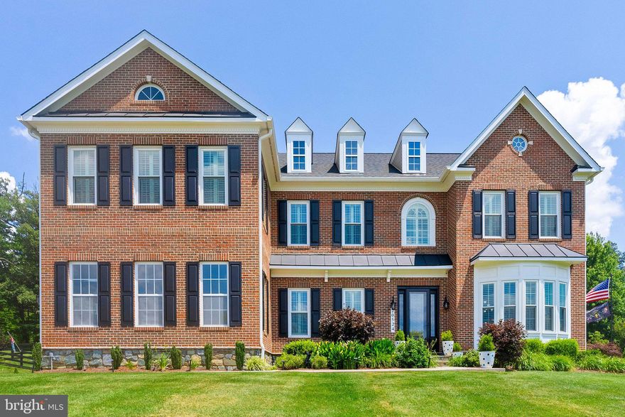 *20524 Stone Fox Court — Timeless Estate on Over 3 Private Acres in Leesburg*
Set on 3.01 acres of beautifully landscaped grounds backing to serene woods, this exceptional Oakton model by Craftmark Homes offers over 7,000 square feet of thoughtfully designed living space. Built in 2012 and meticulously maintained, the home blends refined finishes with a layout that’s as functional as it is impressive.

The main level features rich hardwood flooring, custom light fixtures, and a calming, neutral color palette that enhances the home’s natural light and sense of space. The gourmet kitchen is the true heart of the home—open and airy, with premium appliances, a large center island, and seamless flow to the great room, morning room, and beyond.

Step outside to a spacious screened-in porch, ideal for year-round enjoyment. From quiet mornings to evening entertaining, the porch opens to a stone patio surrounded by evergreens and seasonal plantings—creating a private outdoor retreat with four-season appeal.

Upstairs, four generously sized bedrooms each feature their own en-suite bath, offering privacy and comfort for everyone. The primary suite is truly remarkable—one of the largest in the area—complete with a brand-new, spa-style bathroom featuring an oversized walk-in shower, luxurious soaking tub, and elegant designer finishes.

The finished walkout lower level provides additional living and entertaining space, including a large recreation area, full bath, and fifth bedroom—ideal for guests, in-laws, or flexible use.

Located minutes from downtown Leesburg, Leesburg Premium Outlets, Wegmans, Safeway, and commuter routes including Route 7 and 267, this home offers the perfect balance of privacy, luxury, and everyday convenience.