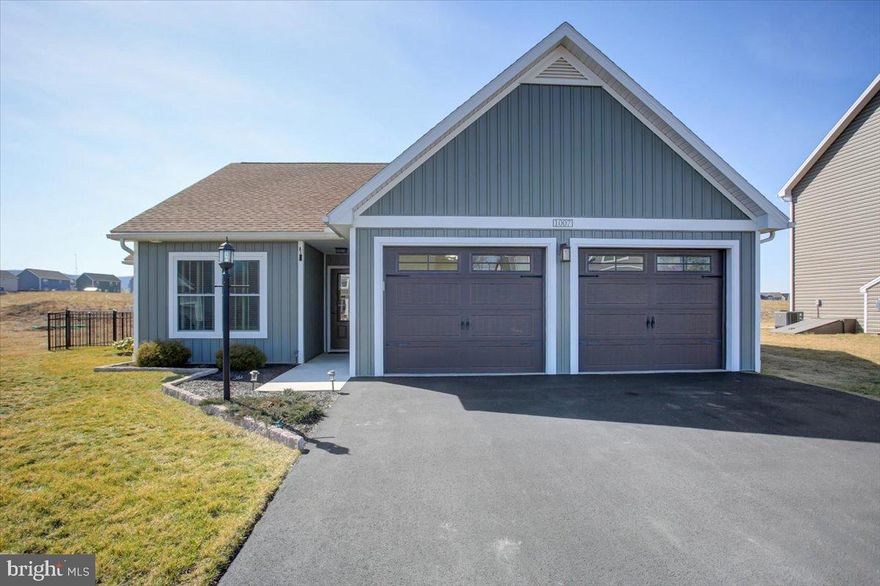 Welcome to 1007 Southwood Dr in Shippensburg! This beautiful home, built in 2022, has been meticulously maintained to feel as fresh as the day it was completed. For the project enthusiast, the garage has been thoughtfully upgraded with a dividing wall and a stylish barn door, plus heating and cooling. A wash sink, washer, and dryer conveniently located just inside the garage door.
High-efficiency glass windows, professionally installed Levolor window treatments, and premium finishes such as dovetailed drawers, hickory cabinets, granite countertops, and stainless steel appliances elevate the home's quality and charm. The second bedroom and living room have been upgraded with sleek LVP flooring, adding a modern clean touch.
You'll enjoy the convenience of both a primary bath and a second full bath. The primary bedroom features a walk-in closet, and there's an additional closet just outside the room for added storage. The 9.5 x 14 screened-in porch has been converted into living space, offering endless possibilities as a den, office, workout room, or more.
The beautifully sodded lawn is complemented by an attractive, no-maintenance black aluminum fence in the backyard. An insulated 18x22 shed provides the perfect workspace or storage solution, while an additional small shed on the side is ideal for gardening tools and lawn equipment.
The land behind the property is leased to a local farmer for at least the next four years, adding to the peaceful, rural feel. This home is truly move-in ready and offers everything you need to live in comfort and style. Don't miss the opportunity to make this exceptional home yours!