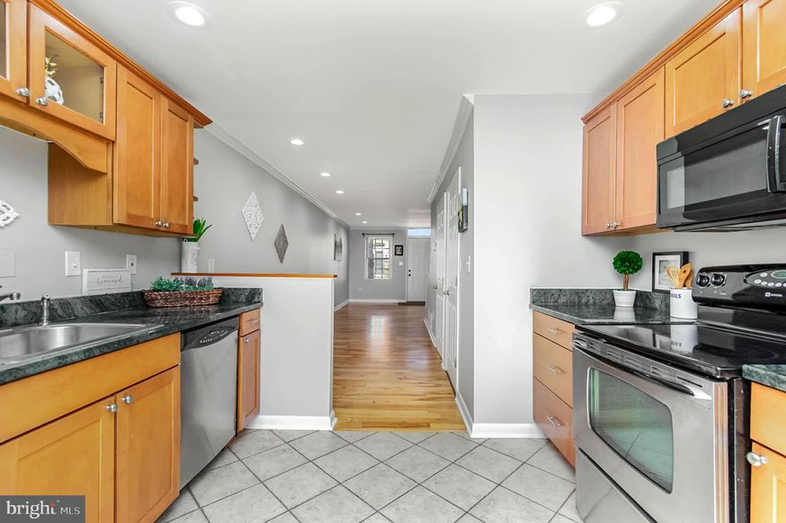 Beautifully updated brick home located on one way, quiet street.  Convenient to everything!  Never worry about parking again for the home games!  Tailgate at your house!  Walking distance to the University of Maryland Medical Center and the Horse Shoe Casino!  Freshly painted, updated LED lights, maple hardwood floor and tile on the main level. Updated kitchen with gorgeous, trendy granite and plenty of storage.  Convenient main level half bath.  New carpet on the upper level with 2 nice sized bedrooms and updated full bath.  The basement is full with plenty of storage!  Don't miss this beautifully updated, move in ready home!