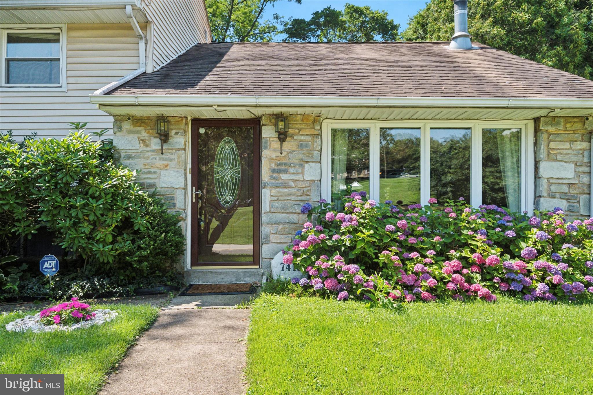 Nestled in the heart of Melrose Park, this lovingly maintained 3-bedroom, 2.1-bath home offers the perfect blend of charm, comfort, and convenience. Situated on a quiet, tree-lined street in sought-after Cheltenham Township, this home has been thoughtfully updated over the past 20 years and is ready for its next chapter. Step inside to discover gleaming hardwood floors and abundant natural light streaming through many newer windows. The spacious living room features a cozy fireplace—ideal for relaxing evenings—while the adjacent dining room is perfect for morning coffee or entertaining guests. The kitchen is both functional and inviting, featuring solid wood cabinetry, two generous pantry cabinets, and a perfectly placed nook for your coffee bar setup. Whether you’re hosting a dinner or enjoying a casual breakfast, this kitchen checks all the boxes.
Upstairs, the large primary bedroom offers two closets and a private en-suite bath with a jetted tub—your own personal retreat. Two additional well-sized bedrooms and a full hall bath complete this level, offering plenty of space for family, guests, or a home office. The lower level adds even more flexible living space, currently set up as a formal dining area, but easily adaptable as a family room, playroom, or office. There’s also a laundry room, an oversized walk-in pantry for all your storage needs, and interior access to the one-car garage. Double water filtration system, a security system with 4 cameras for the techy buyer and the house is framed with lighting (see pictures). Step outside and fall in love with the lush, low-maintenance gardens and serene yard backing up to a picturesque creek. Creek has clean water and has some wildlife in it. Enjoy visits from birds and deer, creating a peaceful natural escape right in your own backyard. There is also a shed with electric and roughed in plumbing so this can be turned into a man-cave or she-shed! Enjoy the fruit trees too- apricot, apple and pear right in your back yard! Additional highlights include: many newer windows throughout, central air conditioning, ample storage space, convenient access to Melrose Park and Elkins Park train stations—ideal for commuters. Easy commute to Center City, major roadways, local dining, shopping, and entertainment.
Enjoy Cheltenham Township’s vibrant community amenities including parks, trails, and a fantastic public library system! This is a home where pride of ownership shines through—and where everyday living feels a little more special. Don’t miss your chance to make it yours!