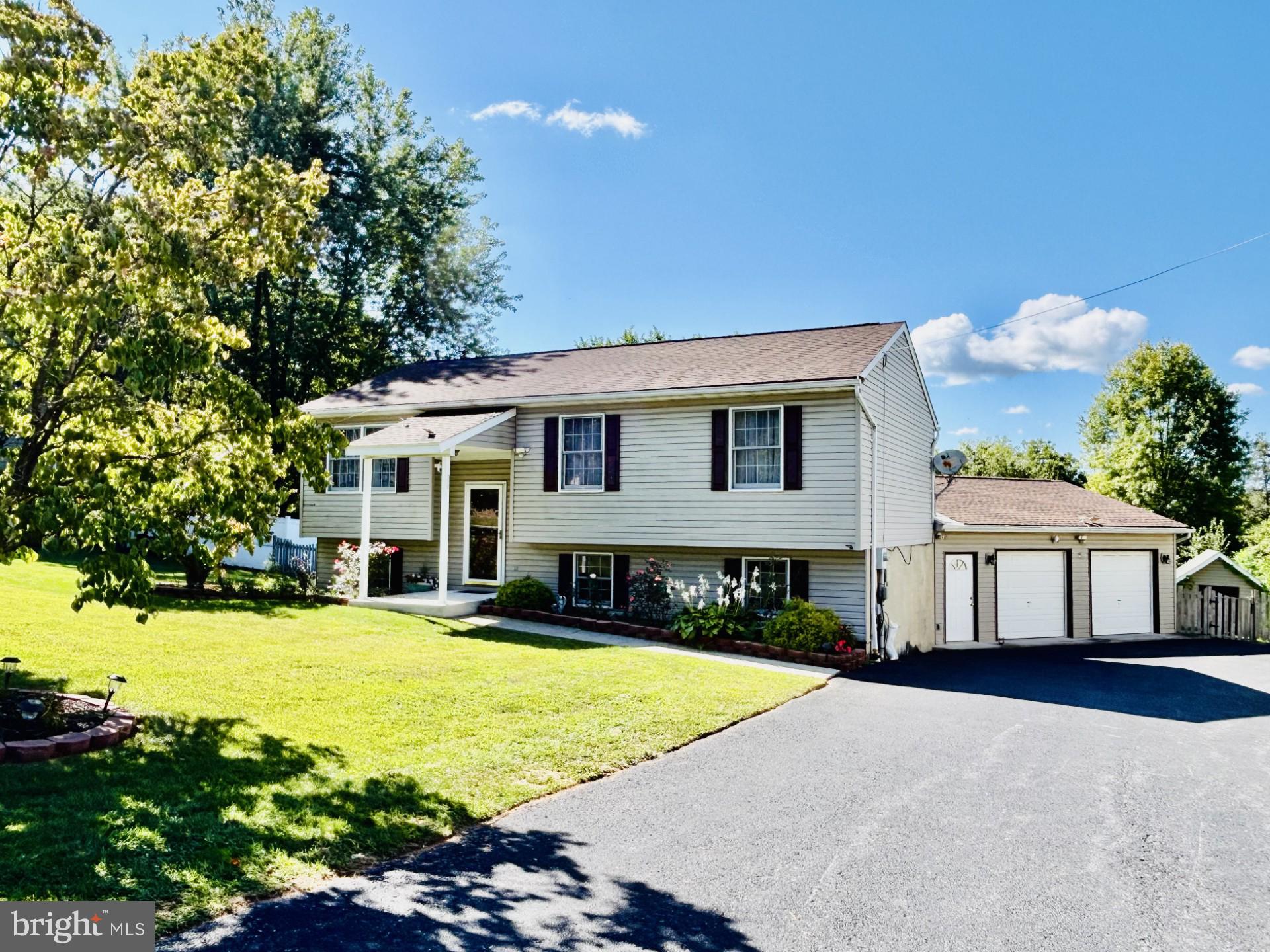 Living is Easy and Pleasant in this Beautifully Maintained, Updated 90's Home in a Country Setting! The First Thing you'll notice is the Large, Level, Fenced Back Yard - perfect for Pets, Family, and Entertaining! You'll Enjoy Overlooking Your Property with the View from atop your Spacious Rear Deck. The Home Features 5 Bedrooms, 2 Full, Remodeled Baths, including Master Bath, a Modern Updated Kitchen, a Cheerful Dining Area awash in Natural Light, Quaint Garden Shed in the Tastefully Landscaped, nearly 1/2 Acre Lot! This Home is Ready for You to Move In and Enjoy! See it Today.