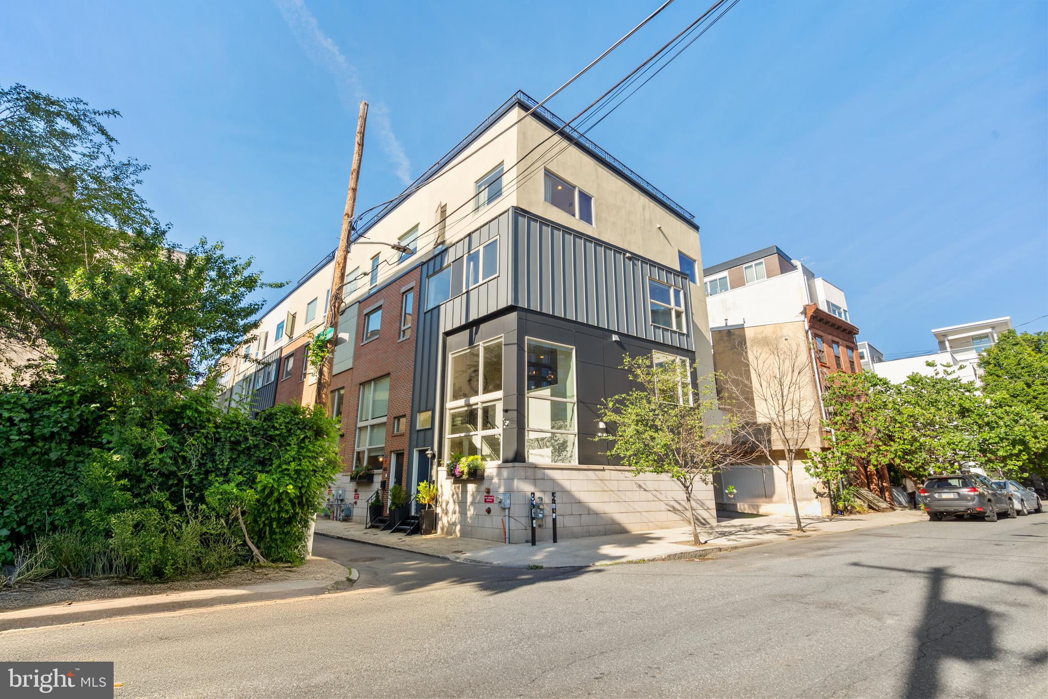 Stunning Corner-Lot Home in the Heart of Northern Liberties – Bright, Spacious, and Impeccably Designed
Welcome to this exceptional 2,200 sq ft home, ideally situated on a premium corner lot in the heart of Northern Liberties. With two full sides of windows, this home is bathed in natural light throughout the day, creating a warm and inviting atmosphere across every level.
Step inside to discover thoughtful design and upscale finishes at every turn. The entry greets you with a staircase that leads to the elevated main floor, where high ceilings and a spacious open-concept layout provide the perfect backdrop for both everyday living and entertaining. The kitchen flows into an expansive living area and dining space that anchors the heart of the home. The kitchen boasts premium Thermador and GE appliances, sleek cabinetry, and a custom-built pantry tucked under the stairs with shelving to keep everything organized and accessible.
On the second floor, you’ll find two generously sized bedrooms and a beautifully appointed full bathroom – perfect for guests or a family office – along with a discreet yet conveniently located washer and dryer.
The entire third floor is dedicated to the private primary suite, offering a serene retreat with a sprawling master bedroom complete with custom automatic blinds, a walk-in closet, and a spa-like ensuite. Indulge in the large walk-in shower featuring dual shower heads, including a rain shower, and a double vanity that balances elegance with functionality.
Hardwood floors and tile span the home, adding timeless style and easy maintenance. The top floor is designed for entertainment and relaxation, with a sleek wet bar—equipped with a sink and fridge—leading out to a spacious roof deck. Whether you’re hosting a gathering or enjoying a quiet evening, the skyline views and open air make it the perfect setting.
Additional highlights include an oversized garage with ample storage and parking space, along with lower level storage, a rare urban convenience. Located steps from the vibrant offerings of 2nd Street, you're within walking distance to trendy restaurants, convenient bodegas, and some of the city’s most dynamic neighborhoods—Old City and the riverside edge of Fishtown.
Don’t miss your chance to own this sun-soaked, beautifully designed home in one of Philadelphia’s most sought-after locations. Schedule your tour today!
