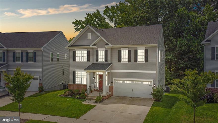 Beautiful 4BR/4.5BA Colonial located in the quiet community of The Preserve at Windlass Run.  Pull up to a beautifully landscaped home, park in the wide driveway, and make your way to the covered front entrance of your forever home. Open the door and step into three floors of gorgeous living space with tons of character, unique designs and eclectic color palette.  The stunning floors run throughout the open concept main floor offering warmth throughout each room and the windows allow for beaming natural light.  Beginning with the open living room with a stunning coffered ceiling and columns defining the separation into the dining room, and views into the heart of the home.  An amazing feature wall in the oversized family room ties in nicely with the granite countertops in the stunning kitchen. The kitchen offers plenty of cabinets finished with crown moldings, a large pantry closet, stainless steel appliances, a complementing backsplash, and a grand island with a deep stainless sink, pendant lighting, and seating for four or more. A half bath and access to the garage completes this floor.  On the second floor you'll find the convenience of laundry, a primary sized bedroom with a private full bath, two similar sized bedrooms sharing a jack and jill bathroom with double sinks, and a grand owners suite.  The oversized owners bedroom offers space for a sitting area that leads into a spectacular ensuite featuring a walk-in shower with built-in bench, a double sink vanity, a large soaking tub, and a walk-in closet.  The lower level is for everyone in the family to enjoy beginning with a den with built-ins in a feature wall, a large game room, a hidden theater room with tiered seating, an office, a full bath, storage, and sliding doors to a paved patio.  From the kitchen, step onto an oversized deck that offers views of the green space below, and steps leading to the lower covered patio giving access to the lower level and all it has to offer. This home is move-in ready with plenty to offer new homeowners including recessed lighting, custom window treatments and decorative lighting fixtures. Imagine all this and in a community with a club house, pool, playground, and in close proximity to shopping, restaurants, and commuter routes.