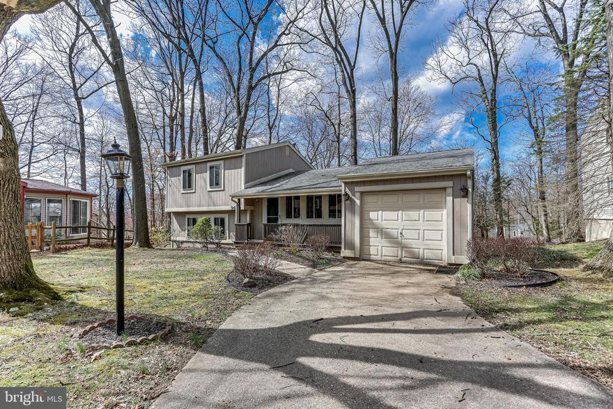 ONE OF THE MOST ROMANTIC  LOCATIONS IN ALL OF OAKLAND MILLS!!!    DRAMATICALLY SITUATED AT THE TOP END  OF  A WOODED CUL-DE-SAC.      SIT ON YOUR ROCKING CHAIR FRONT PORCH AND WATCH THE WORLD GO BY.      ENJOY A COOKOUT OR YOUR MORNING COFFEE ON THE REAR DECK.    BRAND NEW CARPET, FRESHLY PAINTED.   OAK KITCHEN CABINETS. ALL AT THE PRICE OF A TOWNHOUSE!  VACANT, IMMEDIATE POSSESSION.