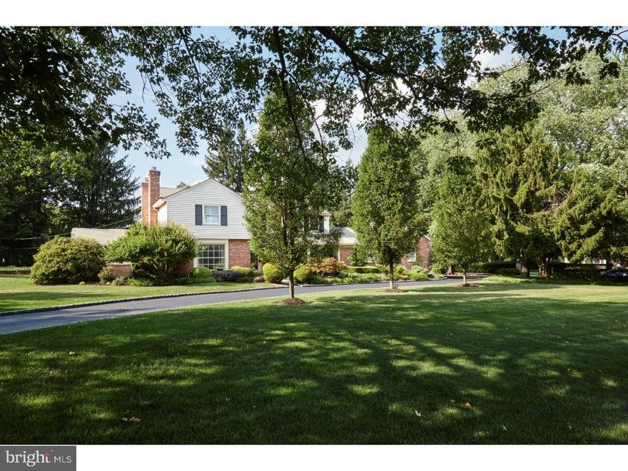 Quiet side of Spring Mill Road with direct views of the Philadelphia Country Club's 9th hole. Totally level one acre lot. Handsome light-filled house sits back from the street. FIVE CAR GARAGE. This home has an excellent floor plan and large, spacious rooms. Sunny family room with fireplace and Paladium window adjoins kitchen and overlooks the yard on three sides. The eat-in kitchen with an island features white stone countertops and backsplash, double sink, stainless Thermador wall oven/warming drawer/microwave combo, stainless Dacor 5 burner gas cooktop/oven, and paneled SubZero refrigerator. The picturesque eating area has views through French doors to the deck and backyard. An elegant sunken Living Room is impressive with it's lovely fireplace, beautiful hardwood floors and expansive views of the golf course through a large picture window. A quietly located library/den sits off of the Living Room. The Center Hall Entryway with double closets also leads to a spacious Dining Room large enough for a crowd! Powder Room and large mud/laundry room with outside entrance are located just off of kitchen and the 5 car attached garage. Second floor boasts 4 equally spacious bedrooms and 3 baths, including a newly remodeled marble master bath with whirlpool tub, shower and double sink. The full, partially finished basement has a collectors size wine cellar for the grown-ups and plenty of play space for the younger set. Many new systems over the last several years include a new roof, new A/C, new tankless hot water heater, new 50 year plus septic system and new master bath. This house has been thoughtfully and meticulously cared for by the current owners for over 30 years and is ready for a new owner. Great value here. Quick settlement available.