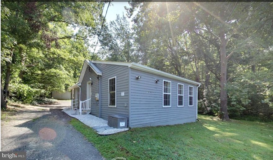 Come fall in love with this adorable, updated one level home surrounded by a wooded, 1.96 acre lot!  Rare find in Prince George's County.  The home was completely renovated in 2020 and a new roof installed in 2021.  As you enter, the open floor plan provides a great space for cooking and dining in the updated kitchen with granite counters, white shaker cabinets and neutral laminate flooring.  Just off the kitchen is the washer/dryer and pantry space. The home offers 3 large bedrooms, an updated full bath and and additional space with double closets that could be used as a playroom or office. The huge yard is a tranquil space for gardening, a play area or a time to relax and enjoy nature. This property is just 15 minutes from National Harbor/MGM Casino and Joint Andrews Base, 10 minutes to Fort Washington and just a few minutes to groceries, shopping and more!