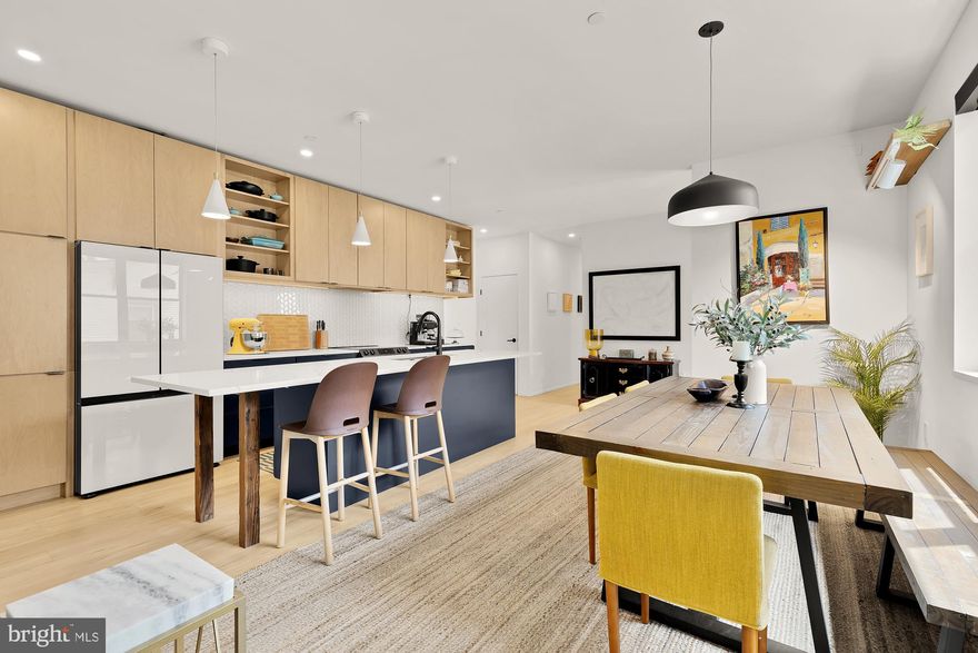 Offering incredible flexibility for modern living, this spacious home features two full kitchens, separate entrances, and a fully finished lower-level suite, perfect for house hackers seeking rental income, multi-generational households, or hosting long-term guests. With over 3,200 square feet of finished space, multiple bonus rooms, and five bedrooms across three levels, there’s room for home offices, guest quarters, creative studios, or whatever life demands. Compared to other homes in the area, 4020 35th St offers exceptional value, without sacrificing style or quality.

Striking design, custom finishes, and a thoughtful layout make this home a standout. The custom wood-paneled wall and bench at the entrance, a mix of maple, ash, walnut, and Douglas fir, is a one-of-a-kind feature that’s both beautiful and functional, setting the stage for everything beyond it.

The heart of the main level is the stunning chef’s kitchen, thoughtfully designed for both style and function. It features sleek quartz countertops, a striking designer tile backsplash, and custom eco-friendly cabinetry by Kitchen Design Pros. Flowing seamlessly from the kitchen, the open-concept living and dining area is bathed in natural light, thanks to expansive energy-efficient windows throughout the home. These oversized windows blur the line between indoors and out, creating a harmonious connection to nature and enhancing the home’s spacious, airy feel. The result is a light-filled, welcoming environment with exceptional flow, perfect for both entertaining and everyday living.

Step through impressive sliding glass doors to a large rear deck, ideal for entertaining or relaxing while overlooking the expansive backyard. Directly beyond the gated yard are two parking spaces. The main level is rounded out by the first of five bedrooms, with a distinctive black-and-white designed bathroom accessible from both the main living area and the bedroom.

Upstairs, the primary bedroom features soaring ceilings and expansive windows that overlook the lush backyard, flooding the space with natural light. The ensuite bathroom and custom walk-in closet make this a true retreat. A conveniently located washer and dryer on this level add ease and efficiency to everyday living. The third and fourth bedrooms, as well as a third full bathroom, complete this level. Upstairs, you’ll find a bonus room, your new yoga studio, home office, or movie night retreat, anything is possible here.

The lower level of the home, which has its own private entrance, features a beautiful second kitchen, as well as a large bedroom and a fourth stunning full bathroom. Every inch of this home has been crafted with purpose, blending timeless design with modern functionality. From its artisan wood accents to its sun-soaked living spaces and flexible multi-level layout, this is more than just a place to live, it’s a space to thrive. Whether you’re hosting under the stars, unwinding in your private retreat, or welcoming guests into the in-law suite, this home adapts to your lifestyle with style and ease. Come experience a home where thoughtful design meets inspired living, your sanctuary awaits.