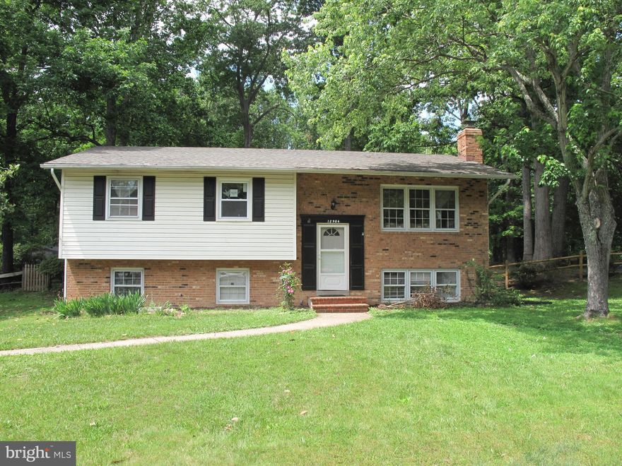 Sentrilock box on front door 6Oct22. New white kitchen cabinets with new glass top white stove, new white 36Inch wide side by side refrigerator, new white quartz countertop, new vinyl plank kitchen floor, new interior paint. New carpet over Hardwood floors on upper level.  Corner lot allows for additional parking. Backs to trees. Covered  patio, shed, wood burning fireplace, Carrier heat pump
