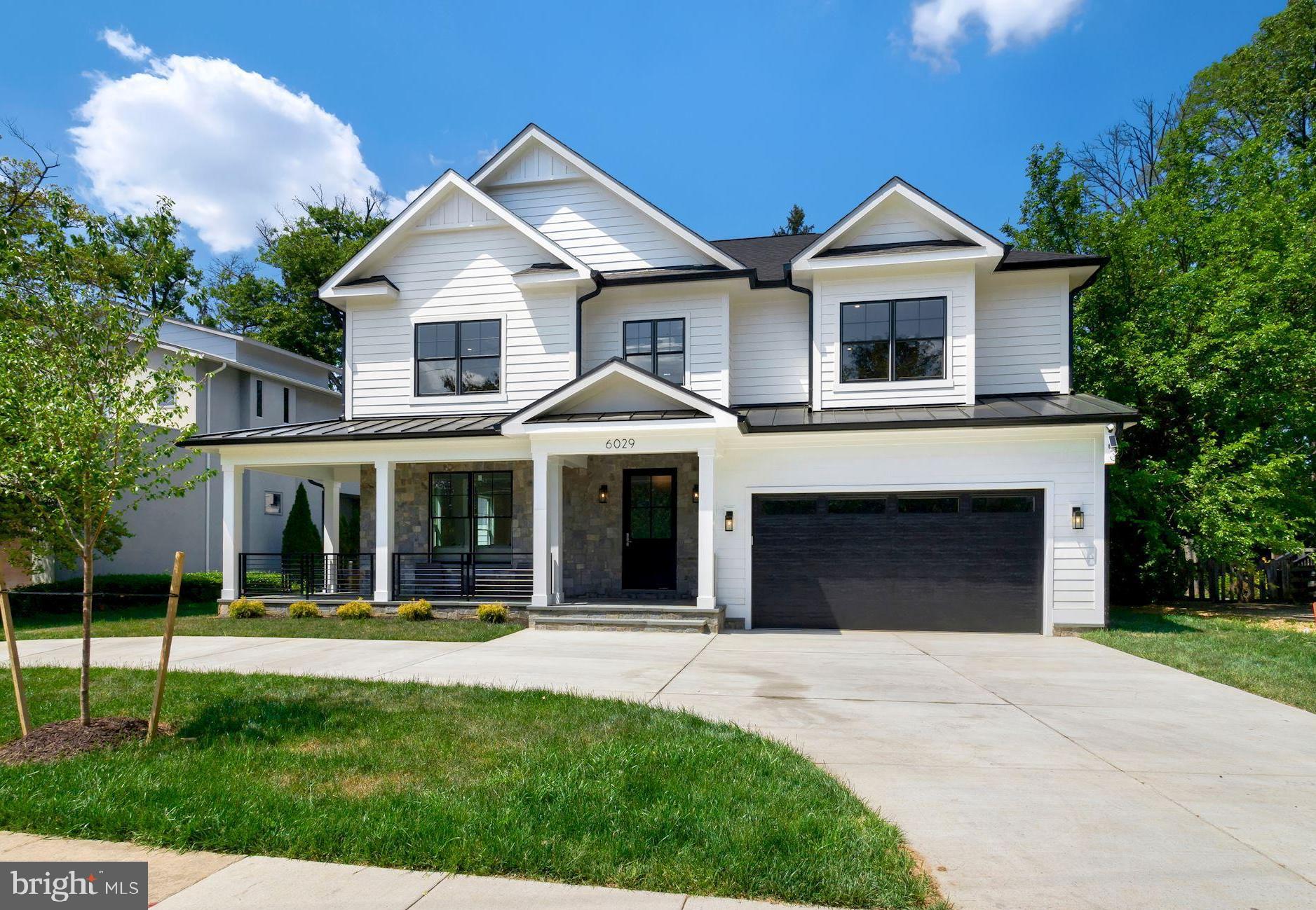 Welcome to the pinnacle of luxury suburban living in sought after Wildwood Manor! Modern convenience and sophistication comprise over 6,200 Sq ft of this centrally located and newly constructed residence. Consisting of 5 Bedrooms, 5.5 Baths and a large den, the functional usage of this home is infinite. As you pull into the circular driveway, the front porch welcomes you with style. Thoughtful design meets grand living on the main level, which holds host to a large formal living room/dining room combination, half bath and a private den. Your formal living spaces flow seamlessly into an expansive gathering room with fireplace that opens directly to your large and inviting rear-flagstone patio and tree lined back yard. Enjoy bright, open sight-lines from your gathering room into your gourmet custom kitchen with breakfast area. Adjacent to the kitchen, a large mudroom with ample storage leads you into your two car garage, adding to the ease and functionality of everyday life. The upper level contains an opulent and expansive primary bedroom with dual walk in closets, an oversized en suite with soaker tub, glass shower, water closet and massive double vanity, all tastefully appointed with Grohe plumbing fixtures. Three additional and substantially sized bedrooms on the upper level are adorned with full en suite bathrooms and custom fitted closet systems throughout. The lower level of the residence boasts another massive bedroom, full bathroom, second gathering area with wet bar, gym/studio area, and even more flex space to suit life's growing needs! The residence is centrally situated to afford the ideal home-life balance; just steps to Wildwood Shopping Center, Georgetown Square Shopping Center, Walter Johnson and Westfield Montgomery Mall. With Grosvenor's Park and Ride Metro less than 1.5 miles away and easy access to major commuter arteries, you're never too far from where you need to be! Create the life you want to live at 6029 Grosvenor Lane.