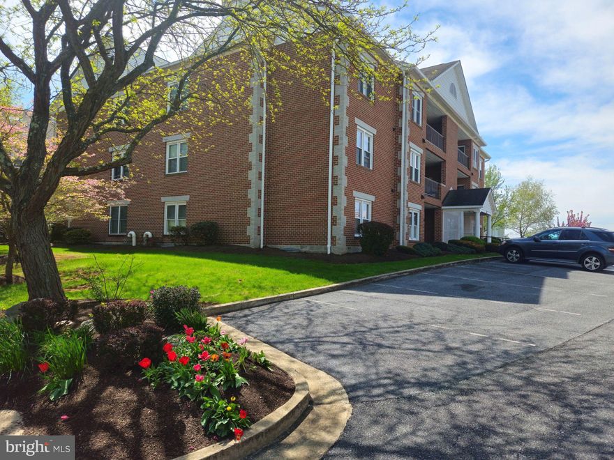 OPEN HOUSE CANCELLED ! Rarely available condo with elevator access and garage! Located in the quiet town of Thurmont and perfectly placed on the second level, capturing the best energy efficiency! This well maintained unit boasts hardwood floors, trim detail through out, spacious rooms with eat in kitchen . Living room and a separate living space  that can be used as sitting area or dining room. Primary suite has ensuite bathroom. Additional bathroom for guests and secondary suite.  Stunning unit in the town of Thurmont with easy access to route 15, and less than 20 minutes from Frederick and close by hotspot  Gettysburg! Country setting with close by amenities. 55+ community