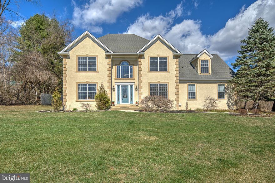 Welcome to 4782 Cobblestone Court, a distinguished center hall colonial nestled in a serene cul-de-sac of six homes in beautiful Buckingham Township. This property boasts 2,798 square feet of living space, offering a harmonious blend of classic design and modern amenities. Upon entering, you are greeted by the inviting foyer flanked by a formal living and dining room. The upgraded kitchen is a chef's delight, featuring stainless steel appliances, granite countertops, and a breakfast room that provides a cozy spot for morning meals. Adjacent to the kitchen is the family room, complete with a charming brick fireplace, perfect for gatherings and relaxation. The main level also includes a sunroom that invites an abundance of natural light, creating a warm and inviting atmosphere. Step outside to the stamped concrete patio, ideal for outdoor entertaining and enjoying the tranquil surroundings. Upstairs, the primary bedroom serves as a private retreat with its own newly remodeled en-suite bath. The home offers three additional bedrooms all with walk-in closets and a second newly remodeled full bath, ensuring comfort and convenience for all residents. Upgrades include a newer HVAC system, hot water heater, and well pump, providing peace of mind and energy efficiency. The exterior of the home has been recently updated, enhancing its curb appeal and ensuring low maintenance for years to come. Situated in a desirable location, this property offers both privacy and proximity to local amenities, schools, and parks. Do not miss the opportunity to own this lovely home!  *Sellers have switched the living room and dining room.