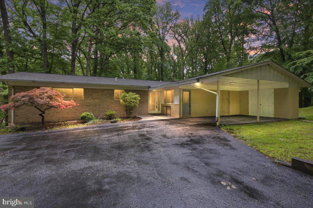 Motivated seller!!
Welcome to 8114 Anita Road located in a quiet, beautiful subdivision of Pikesville Maryland. This is an amazing opportunity to own a 5 bedroom, 3 full bathrooms, all brick rancher that boasts over 3600 ft.² and is situated on a sprawling idyllic 1-acre open lot surrounded by mature growth trees creating a tranquil, peaceful, private setting. This all-brick rancher affords main level living convenience with 4 bedrooms on the first floor, complete with the primary bedroom with updated full master bath, to include dual vanities and a step-in shower with beautiful glass doors, and dual California closets. The first floor also includes a separate dining area, open kitchen, and a beautiful sun filled living room with built-ins and a brick surrounded wood-burning fireplace. Through the living room sliding doors, you enter onto the large deck overlooking your very private rear yard. The lower level is completely finished and includes a large rec room area, updated full bathroom, and a possible 5th bedroom complete with a sprawling walk-in closet with California closet finishes. The lower level is equipped with two separate walkouts to the rear yard, and the side yard. The laundry room is spacious and provides additional room for storage. Recent updates include a new HVAC system in 2024, a new dishwasher, new clothes dryer, and a roof installed in 2010. This charming home also includes a covered car port, and an additional parking pad on the asphalt driveway. Homes in this neighborhood do not come up for sale often. Do not hesitate on your opportunity to secure this beautiful all brick rancher with no mandated HOA and schedule your private tour today.