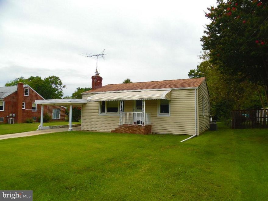 Charming home with huge, fenced backyard! This 2 bedroom boasts a large level lot, carport and enclosed back porch that offers additional indoor/outdoor living space to relax & entertain!  The living room features hardwood floors & cozy, wood burning fireplace.  Great location in a quiet neighborhood convenient to 695, Baltimore City, restaurants & shopping! Call today to tour!